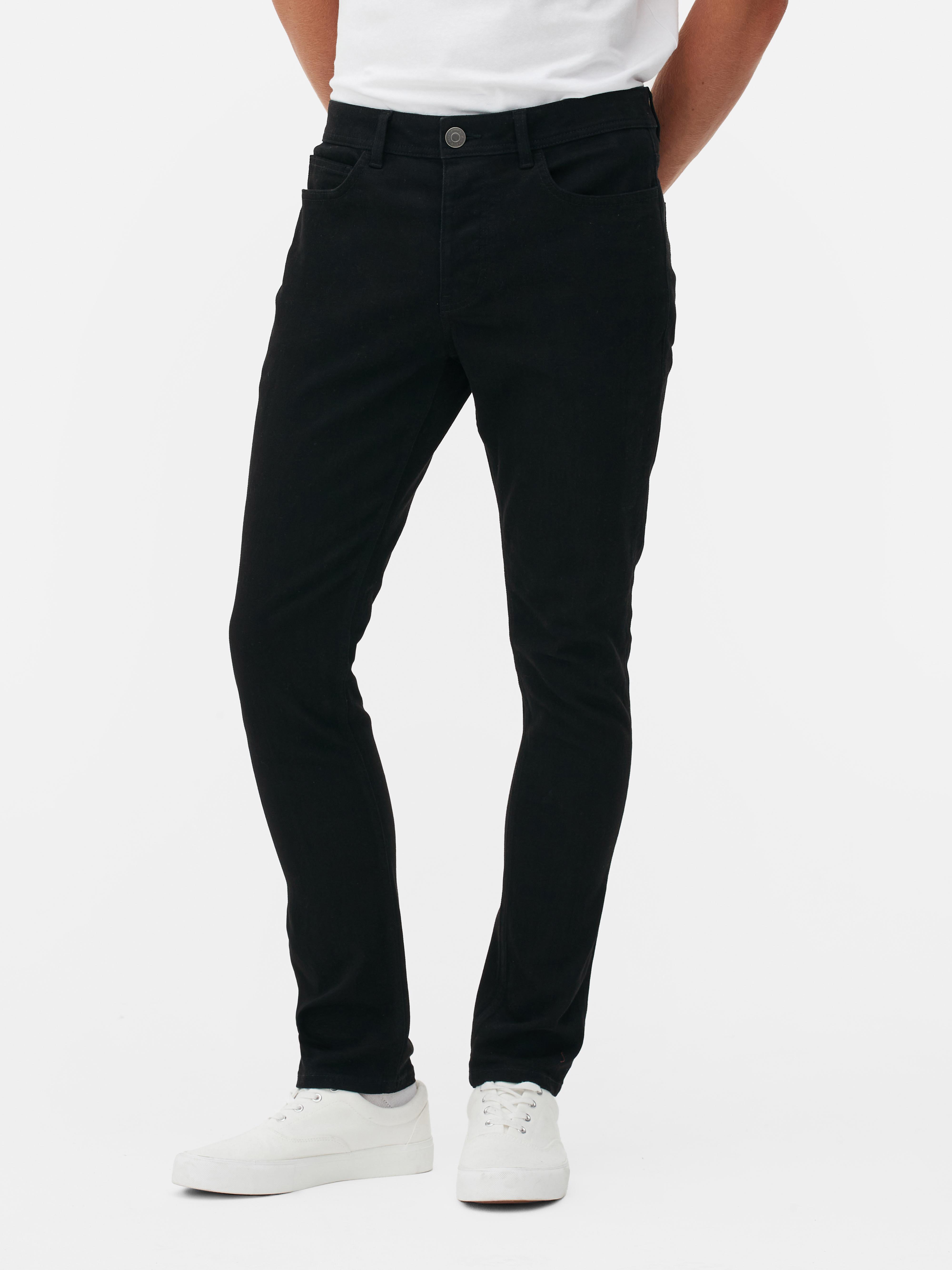 Pantaloni skinny din bumbac twill. Acești pantaloni skinny din bumbac twill prezintă elemente clasice, precum cinci buzunare și găici pentru curea.