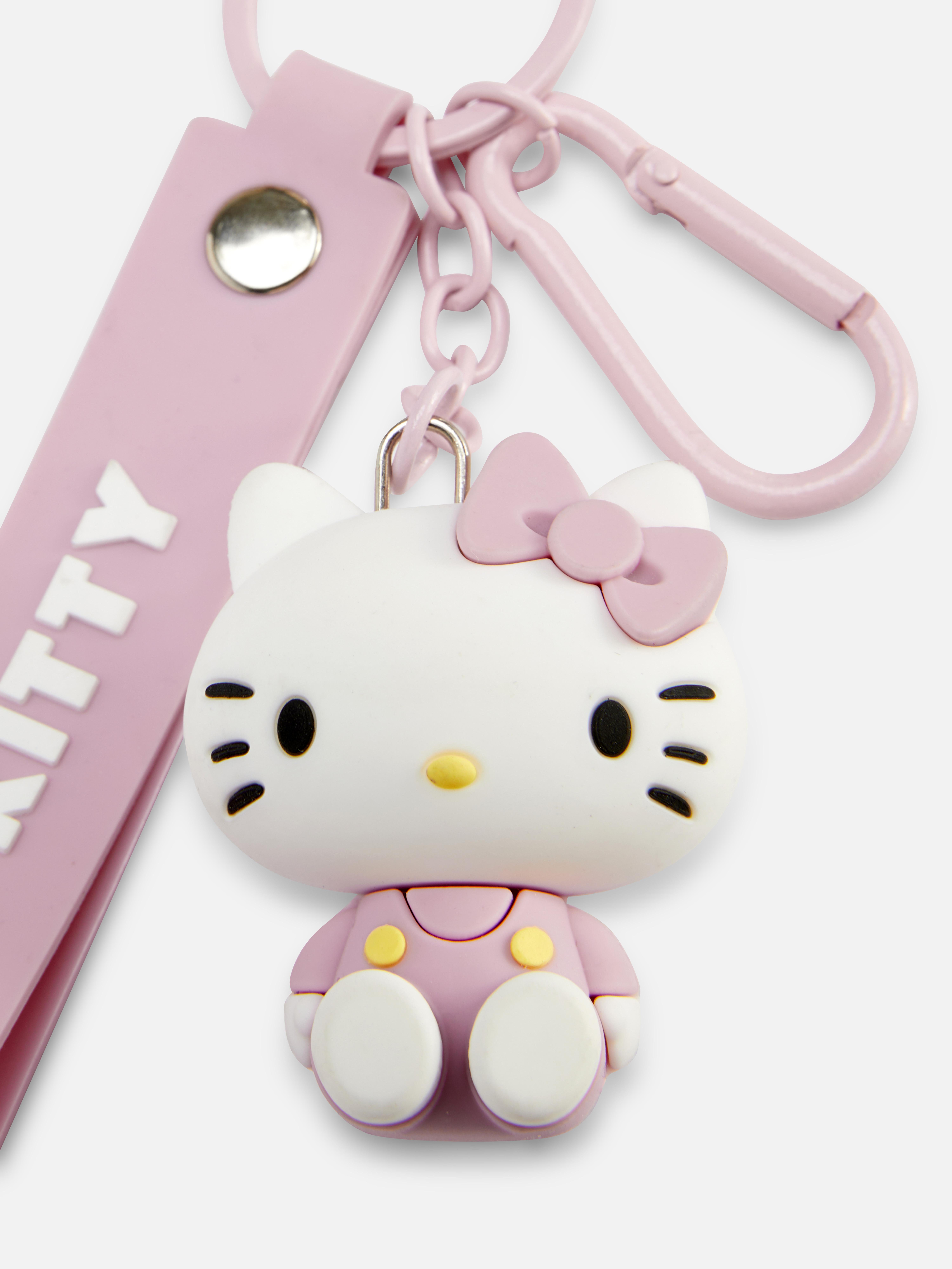 Breloc de călătorie Hello Kitty Un breloc de călătorie cu pandantiv și etichetă cu nume Hello Kitty