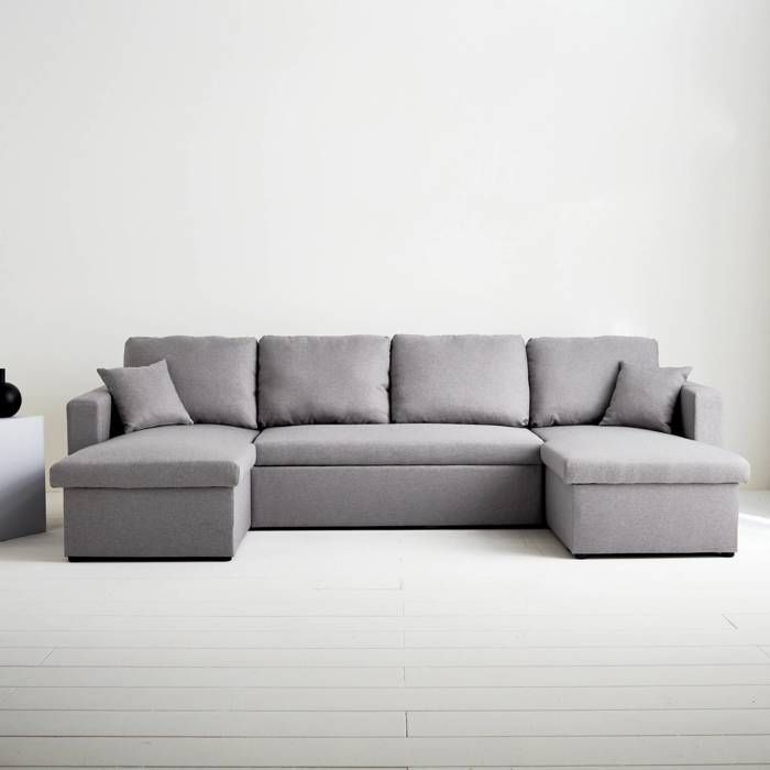 Sofá panorámico convertible en tela gris claro. 4 plazas. Compartimento de almacenamiento. Cama modular.