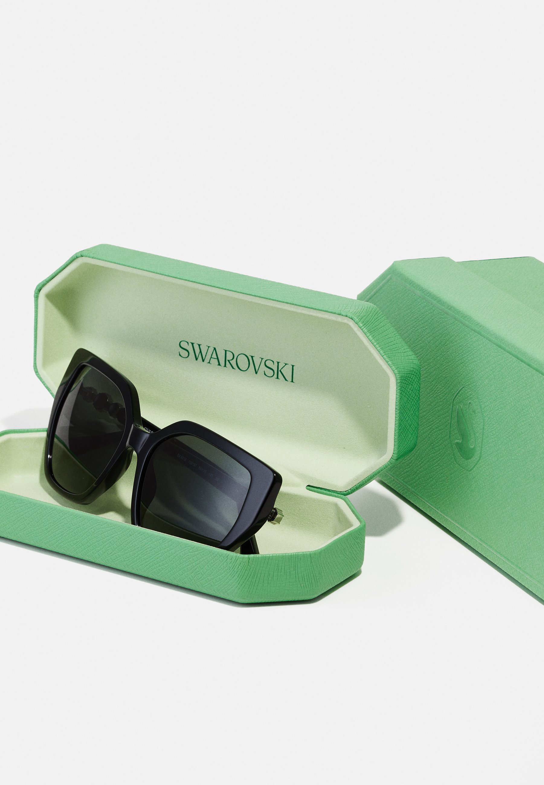 Okulary przeciwsłoneczne Swarovski - czarne/ciemnoszare