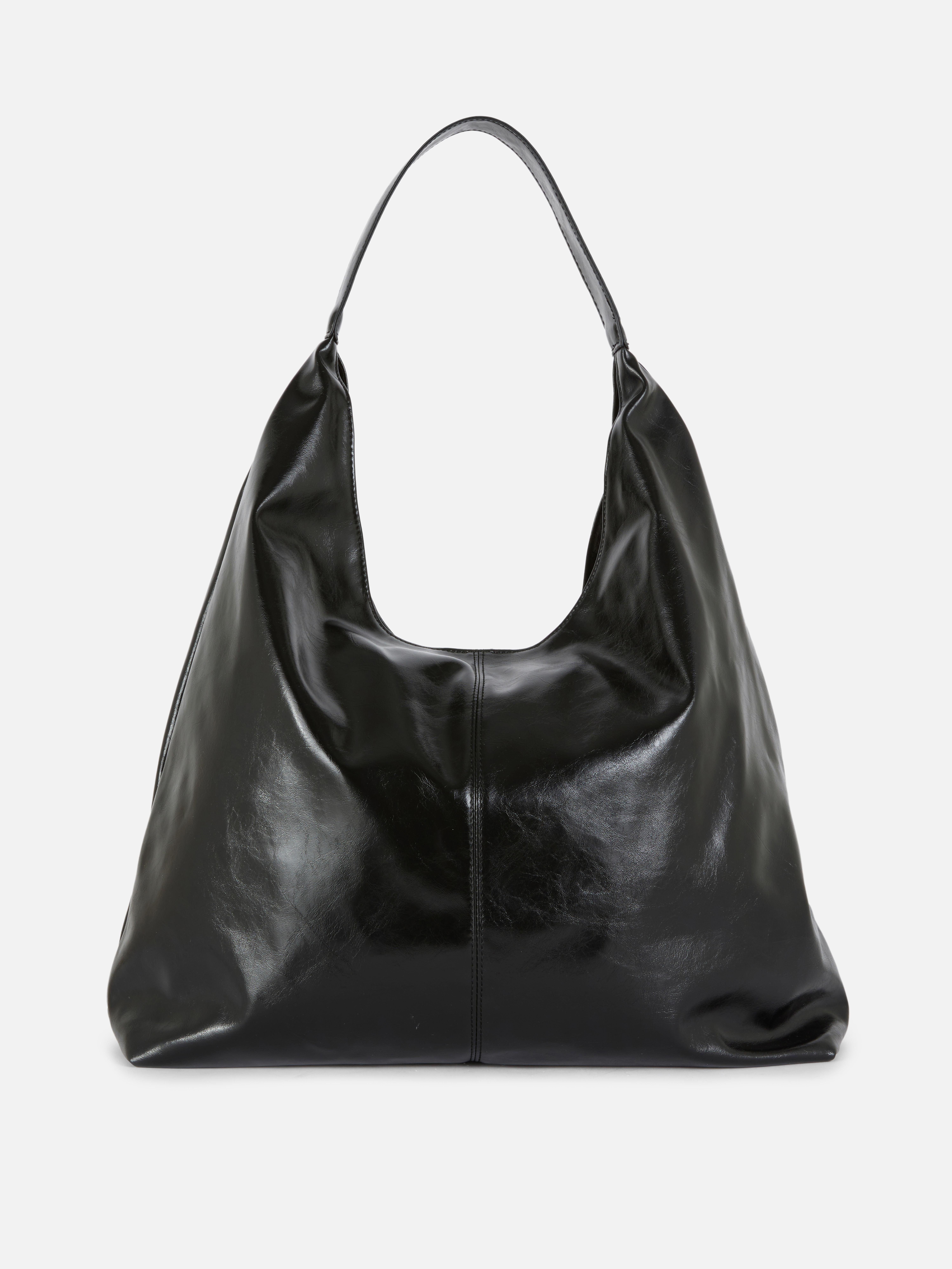 Flexible Tragetasche. Eine bequeme Schultertasche mit Tragegurt, Magnetverschluss und geräumigem Innenfach.