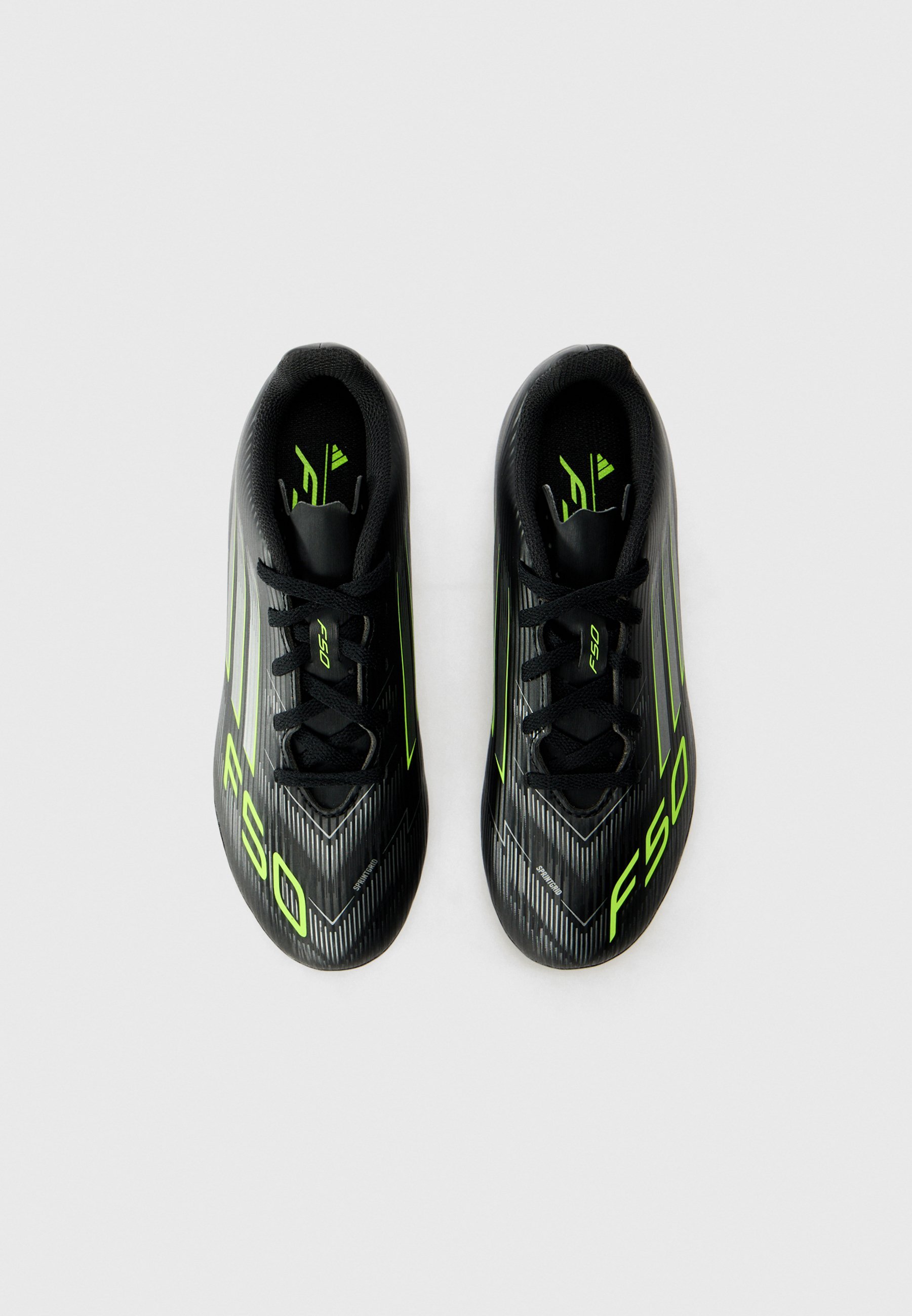 adidas Performance F50 CLUB UNISEX - Voetbalschoenen voor stevige ondergrond - core black/iron coloured/lucid lemon