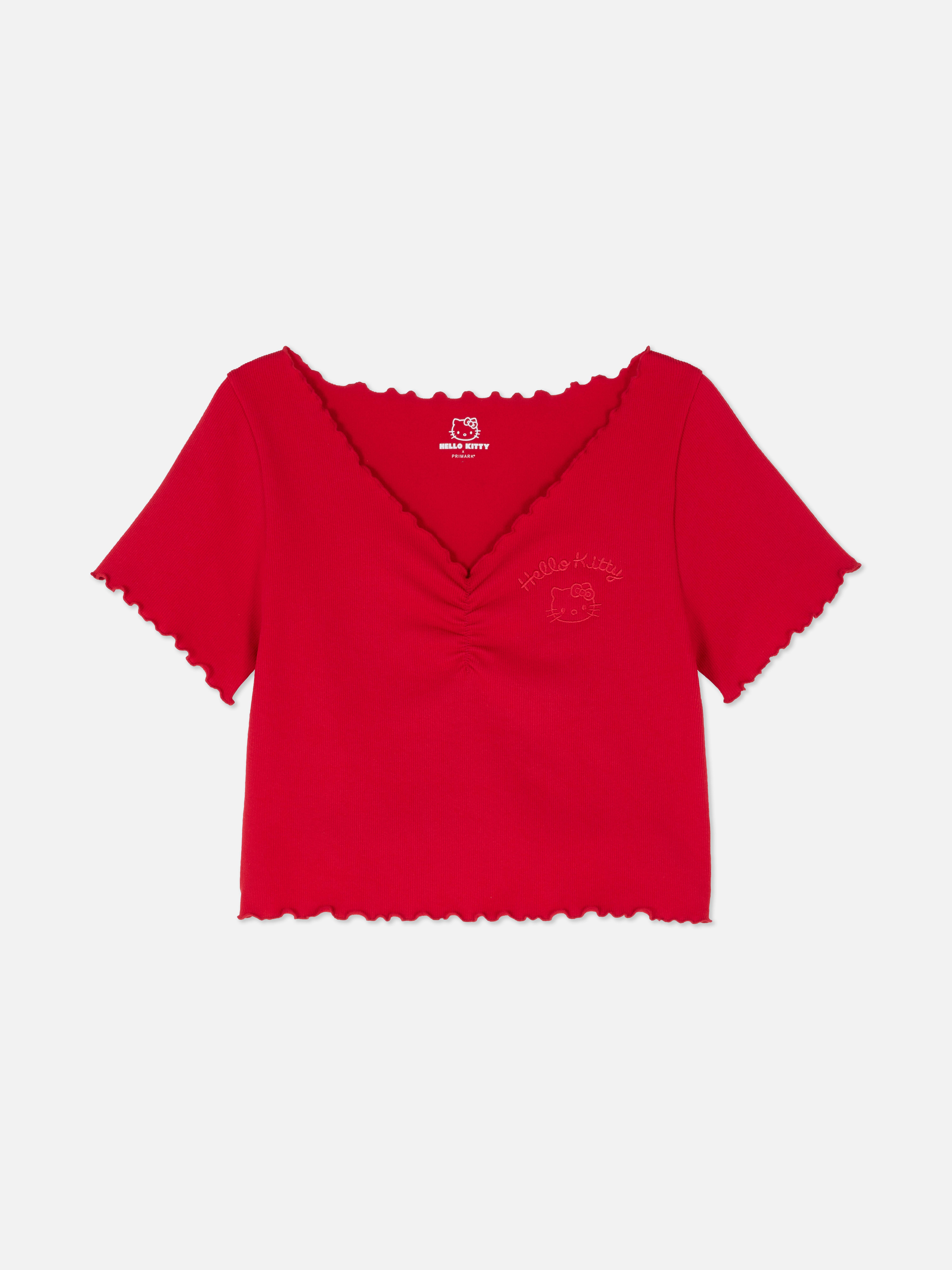 Tricou scurt Hello Kitty Un tricou scurt cu imprimeu Hello Kitty, decolteu în V și tiv festonat