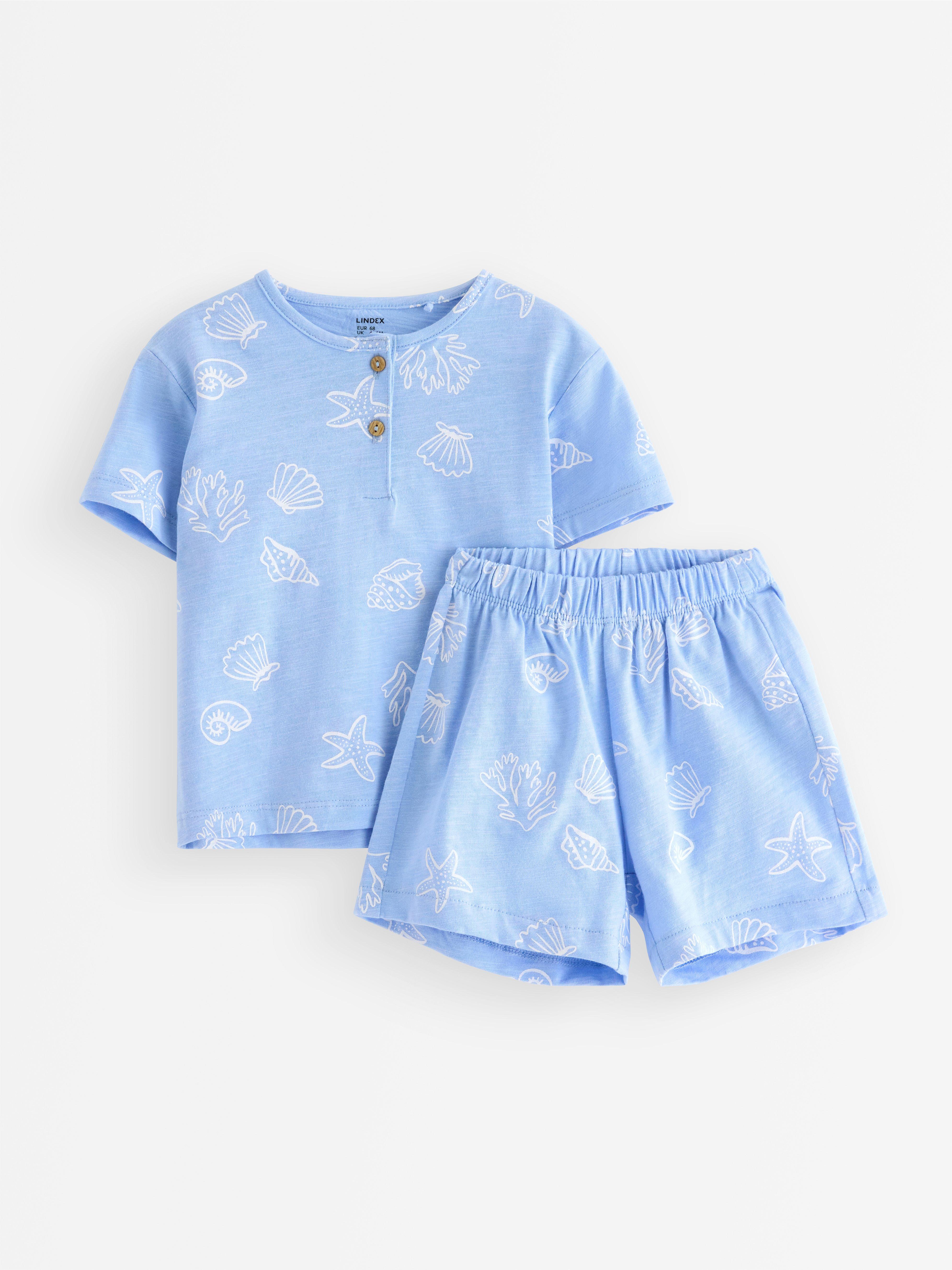 Set - tricou și pantaloni scurți albastru deschis