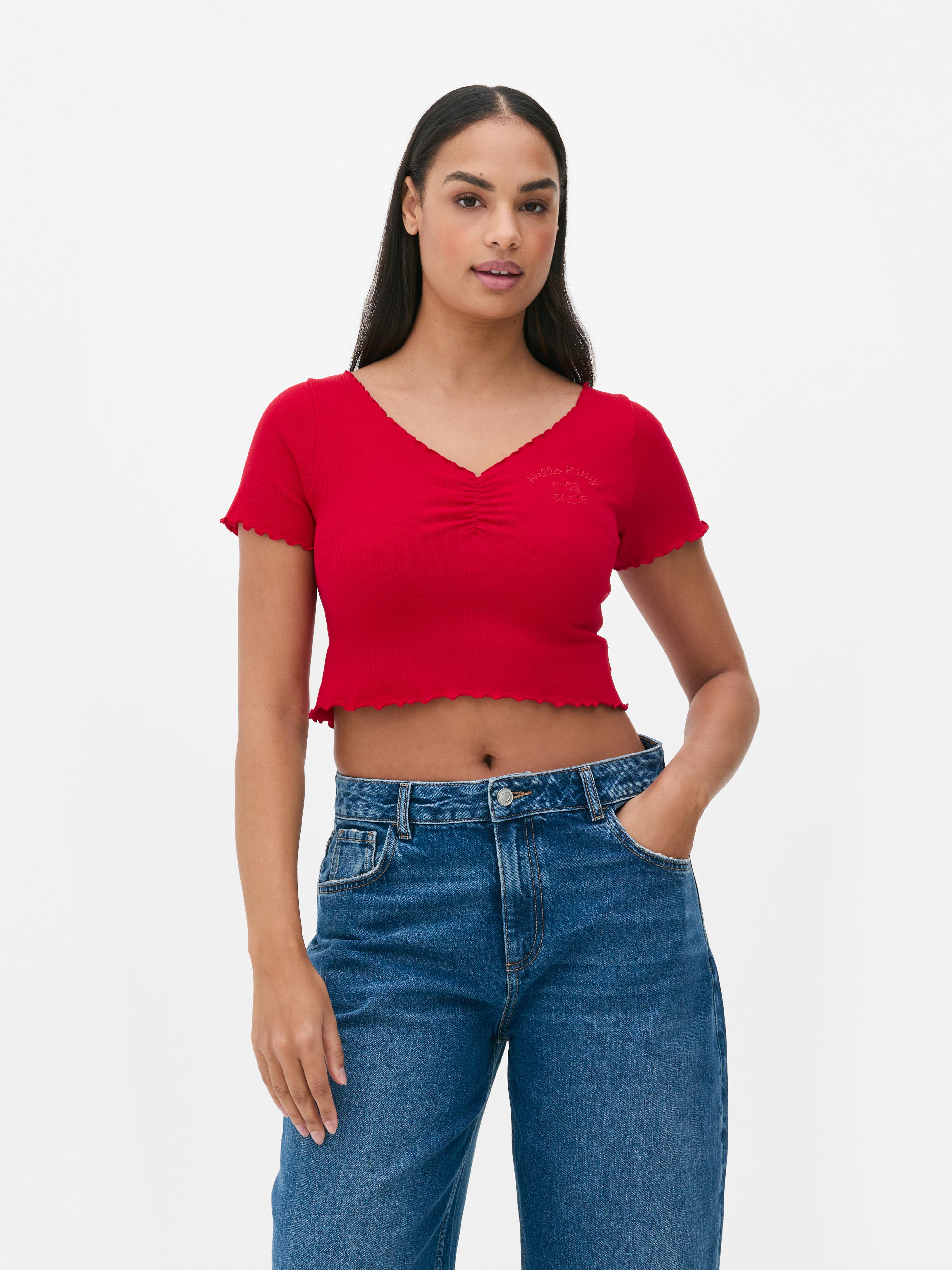 Tricou scurt Hello Kitty Un tricou scurt cu imprimeu Hello Kitty, decolteu în V și tiv festonat