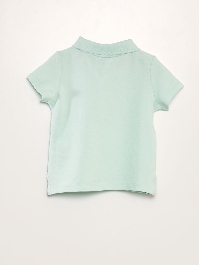 Camisa polo de algodão piqué com estampa de palmeiras - VERDE