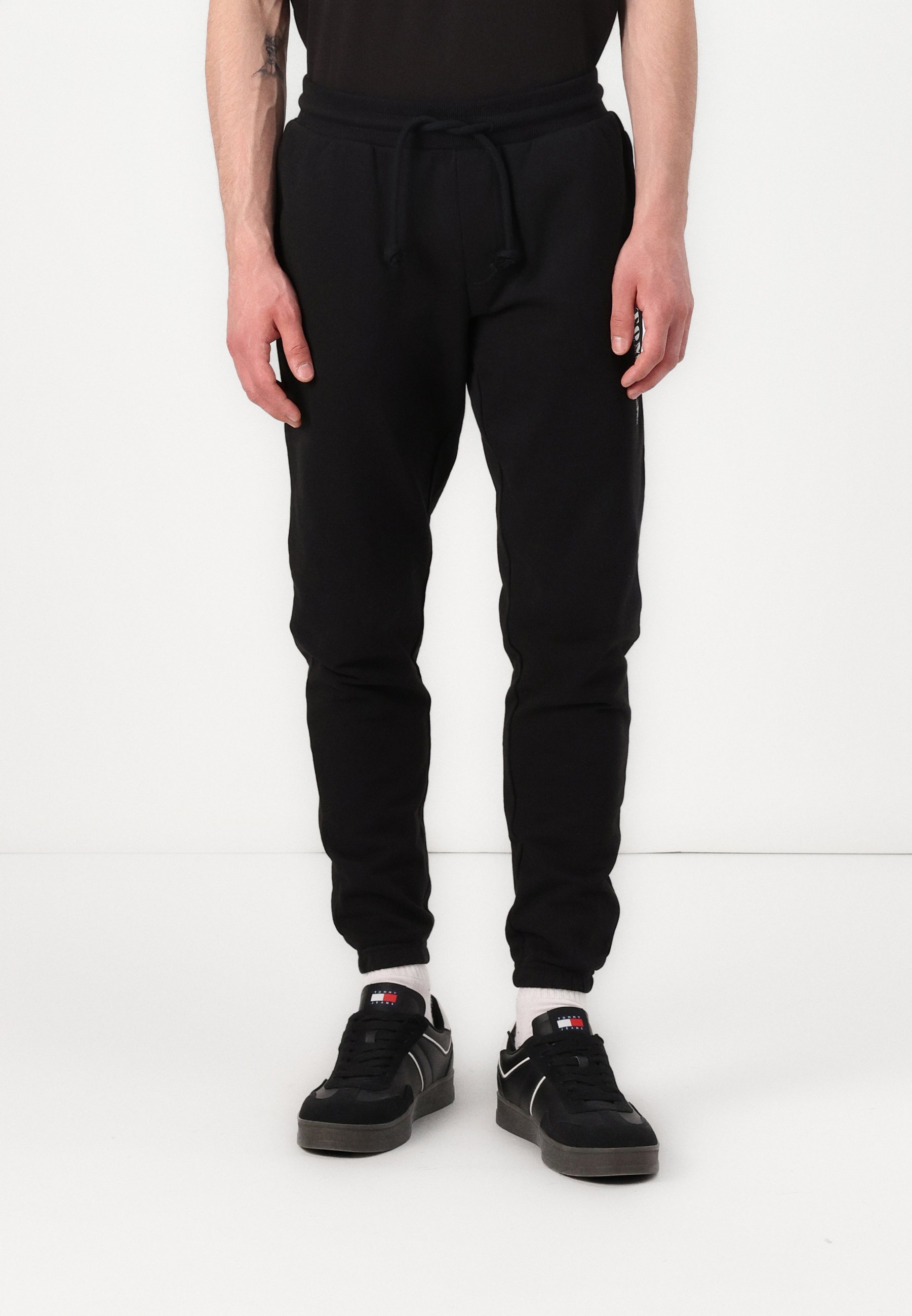 Tommy Jeans SLIM PANT - Trainingshose - schwarz