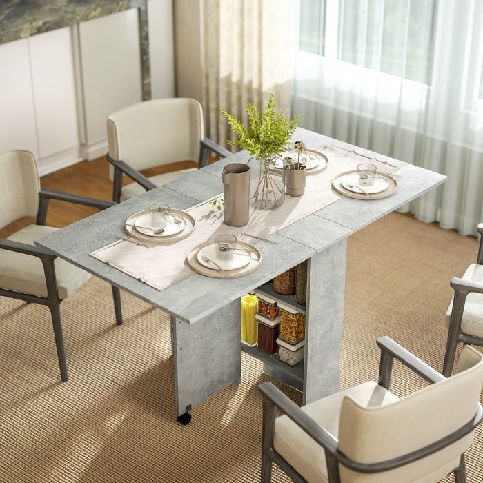 Mesa plegable - HOMCOM - cocina/comedor, desmontable con ruedas, 2 estantes integrados - madera - 75x140x74cm - gris
