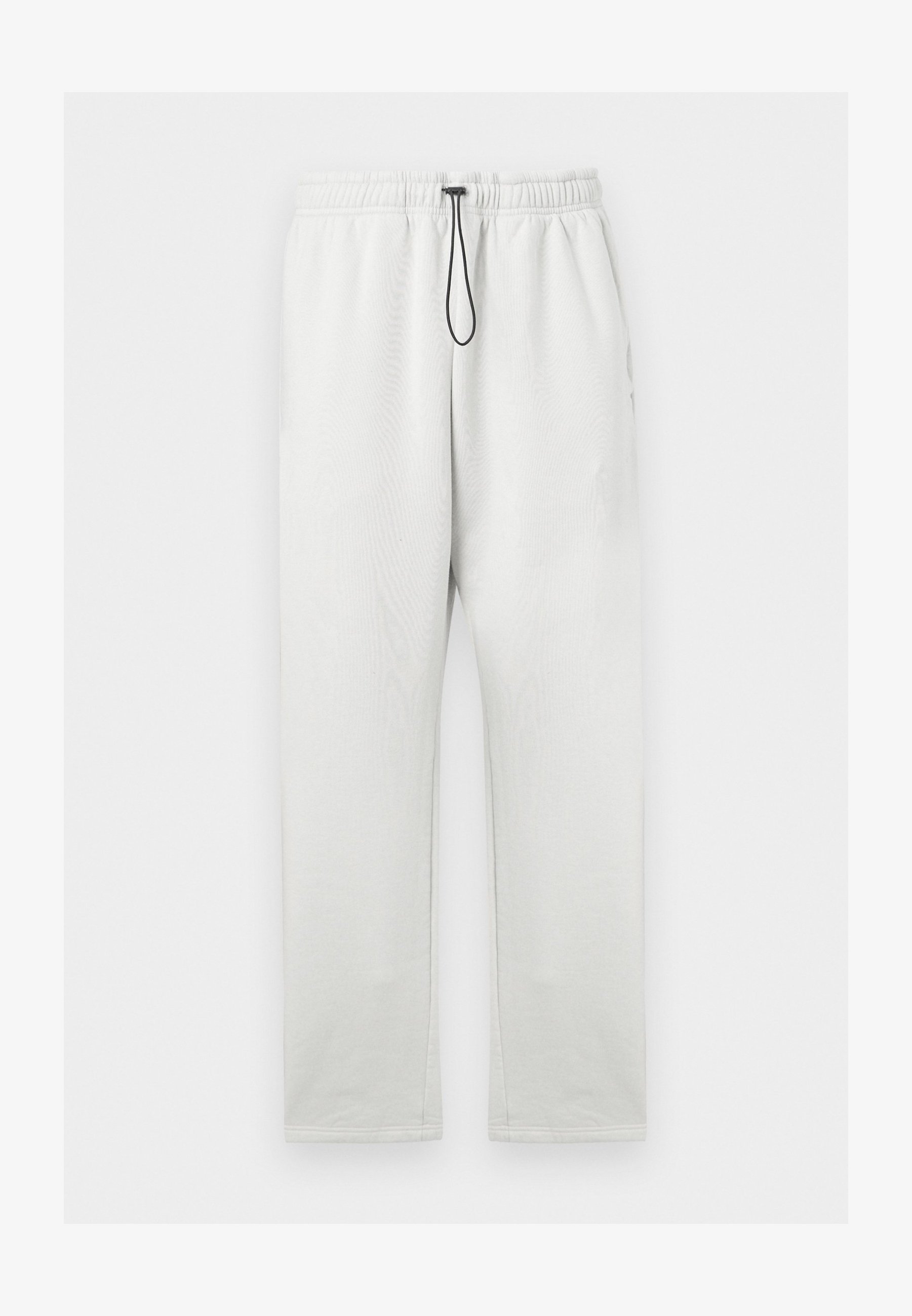 De joggingbroek van The Tracksuit Club
