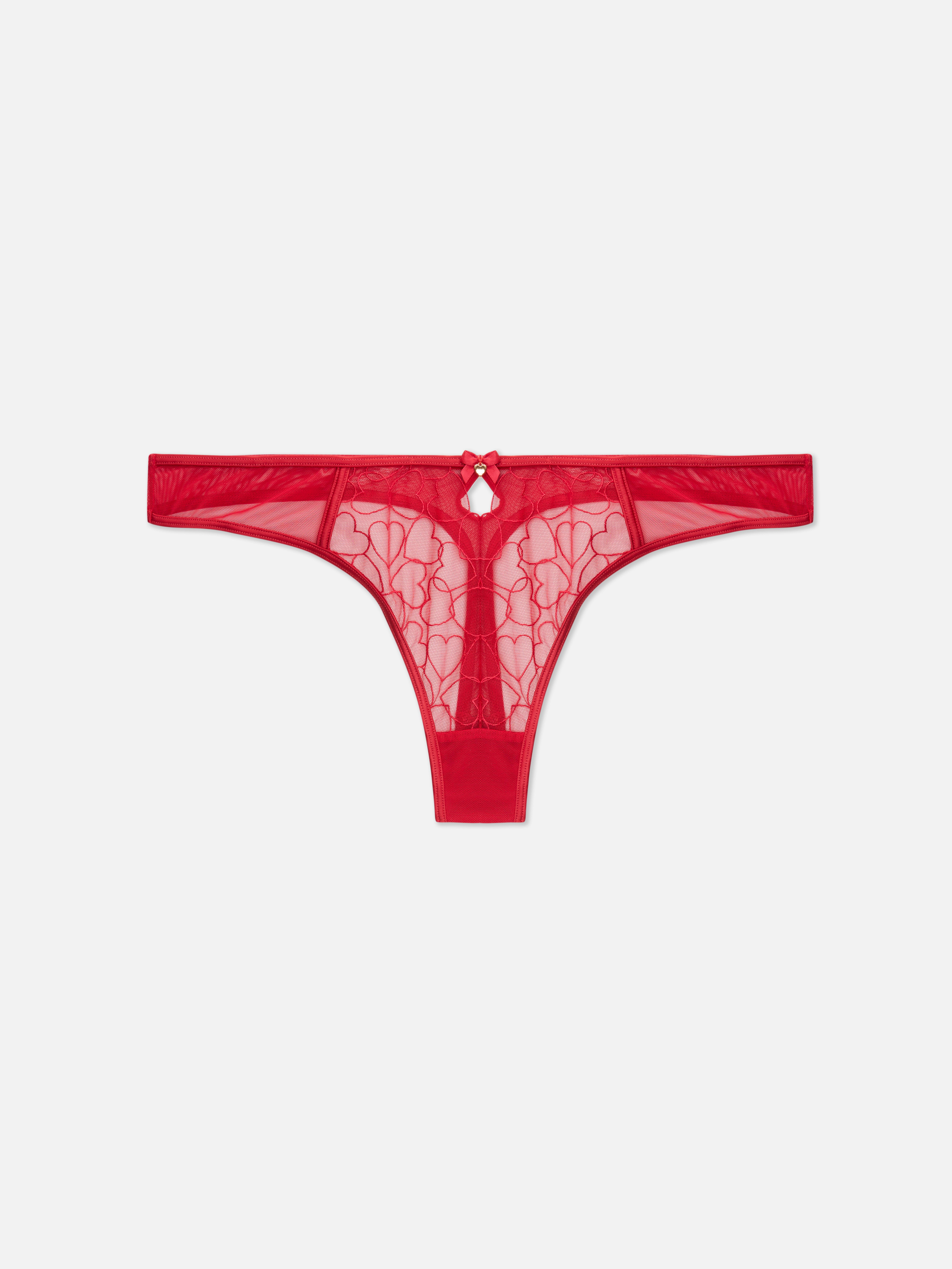 Tanga din plasă cu model de inimă. Această tanga din plasă are inimioare brodate.