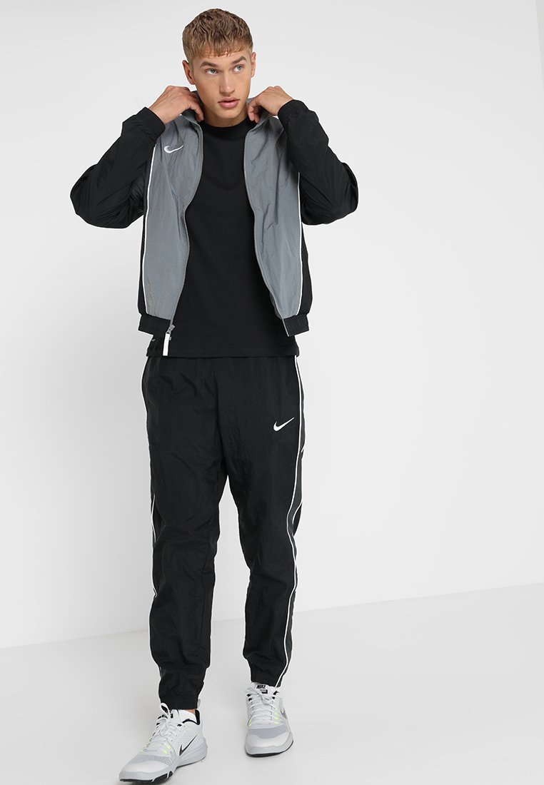 Nike Performance CREW SOLID - Sport-T-Shirt - schwarz/weiß
