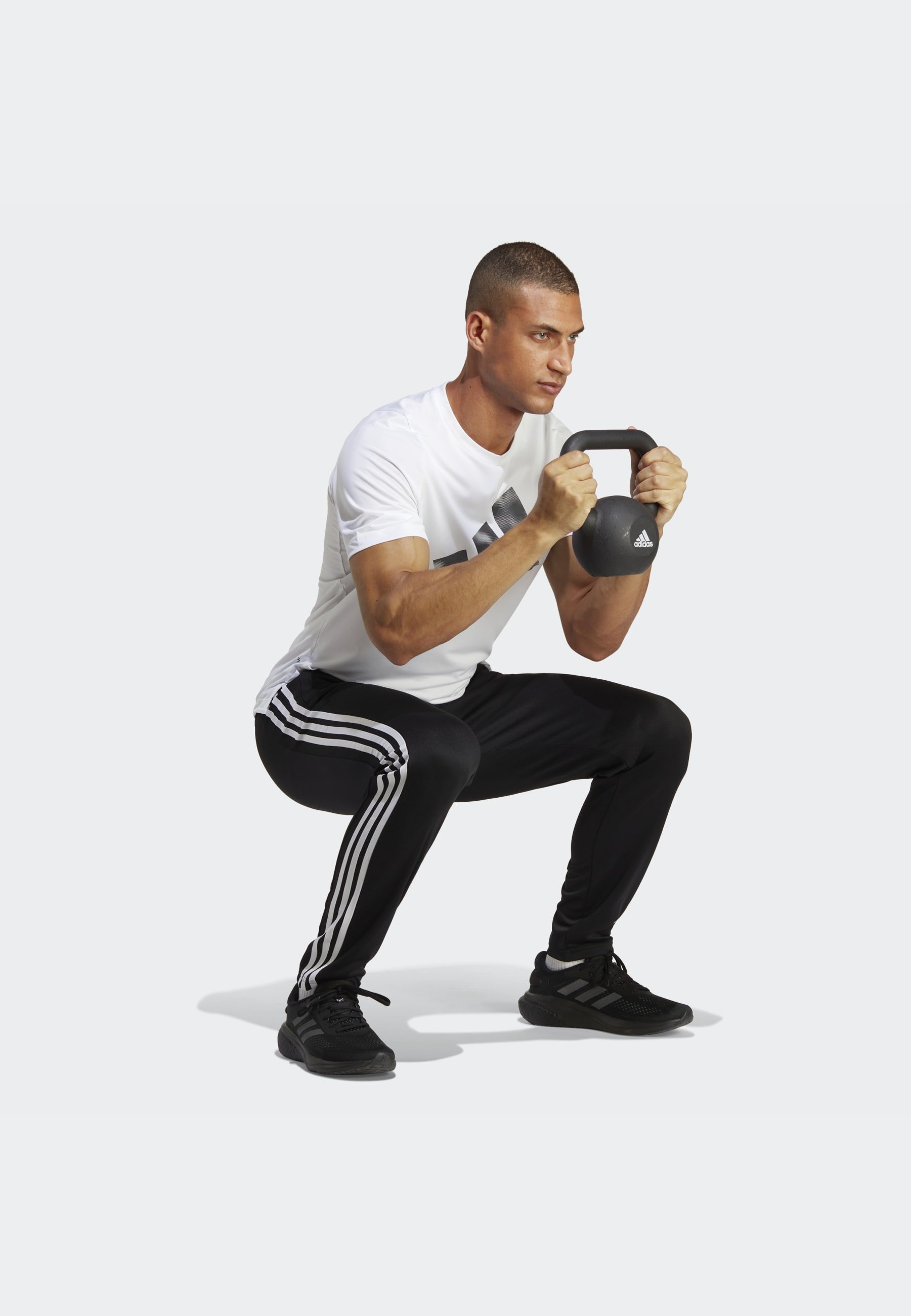 adidas Performance TRAIN ESSENTIALS 3-STRIPES - Pantaloni della tuta - nero/bianco