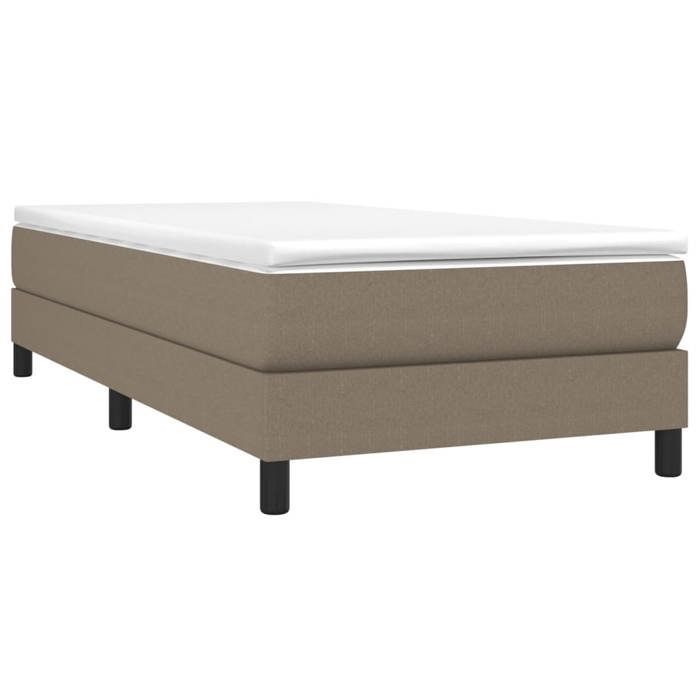 Preciosa estructura de cama individual con somier de láminas, para adultos, tapizada en tela color topo de 90x190 cm, año 1991.