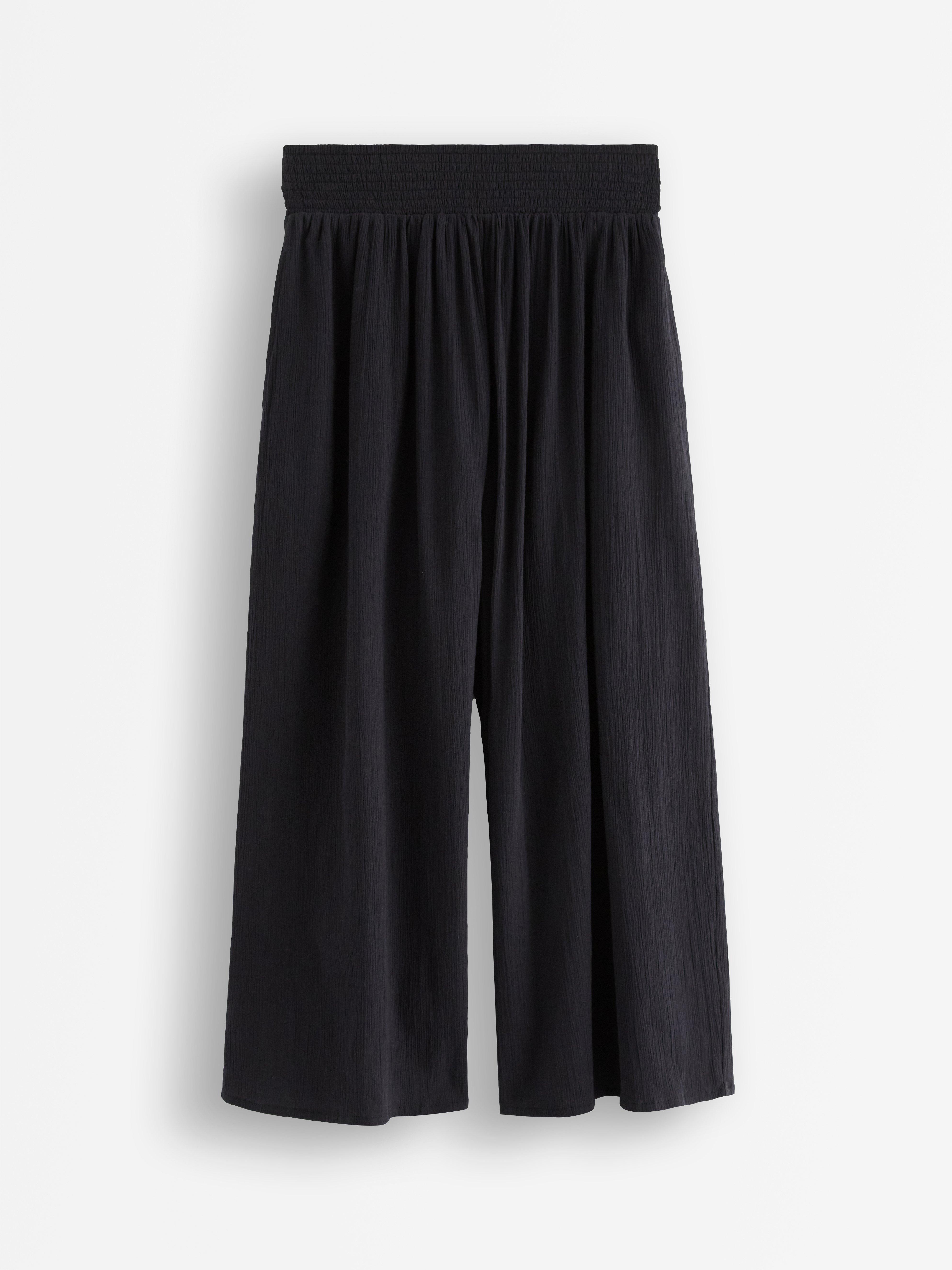 Pantalones anchos tobilleros negros