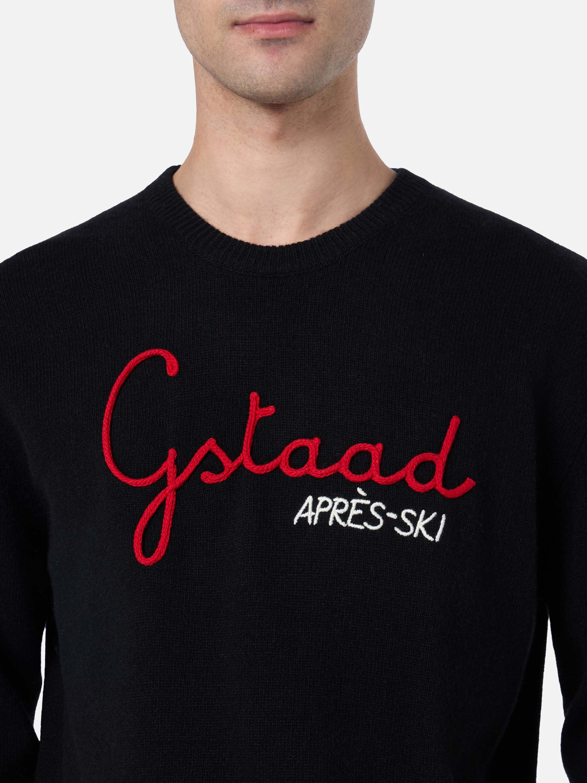 Schwarzer Herrenpullover von Heron mit Gstaad Apres Ski-Stickerei