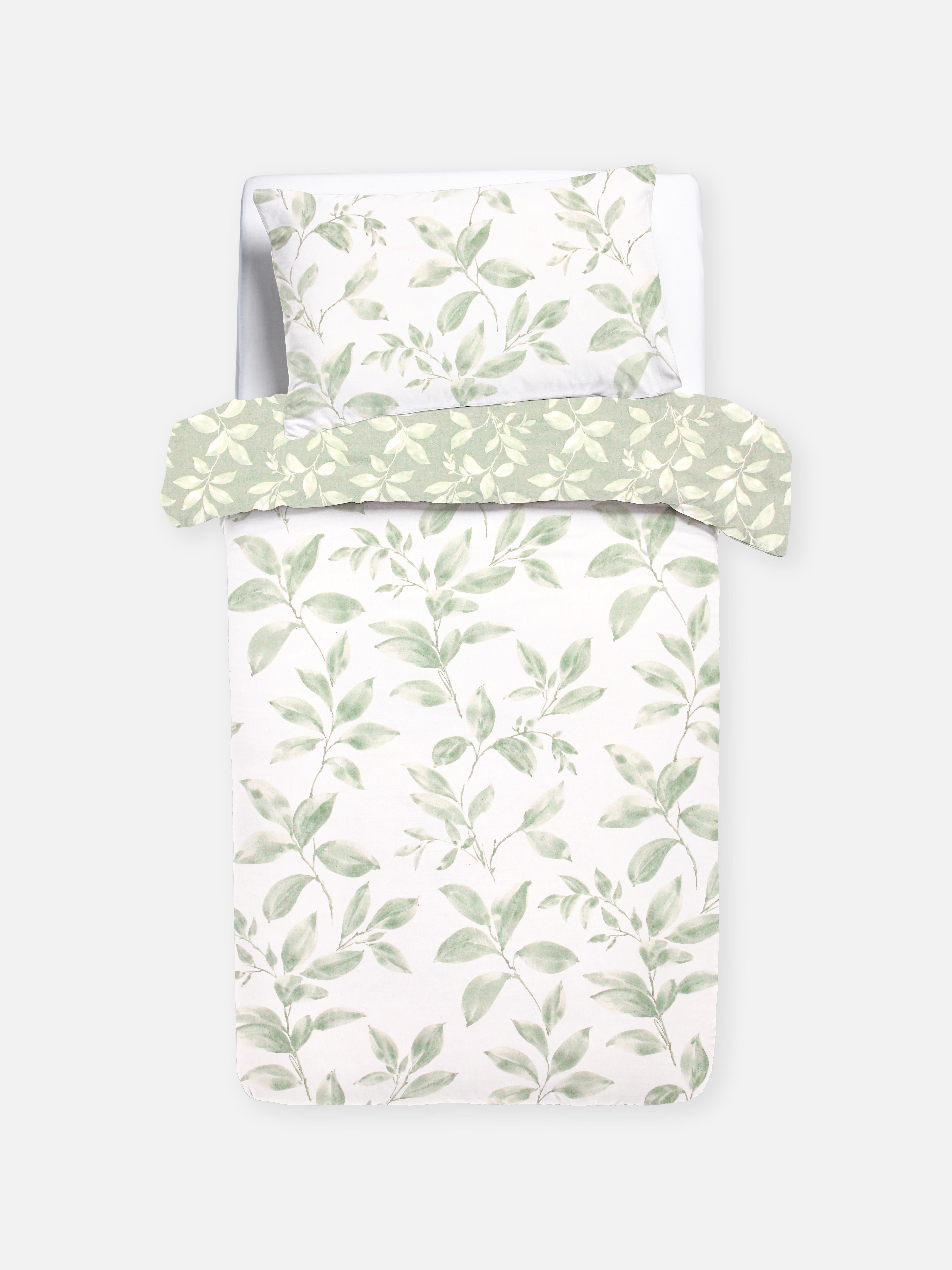 Set de husă de pilotă reversibilă cu motiv de frunze. O husă de pilotă florală cu design reversibil.