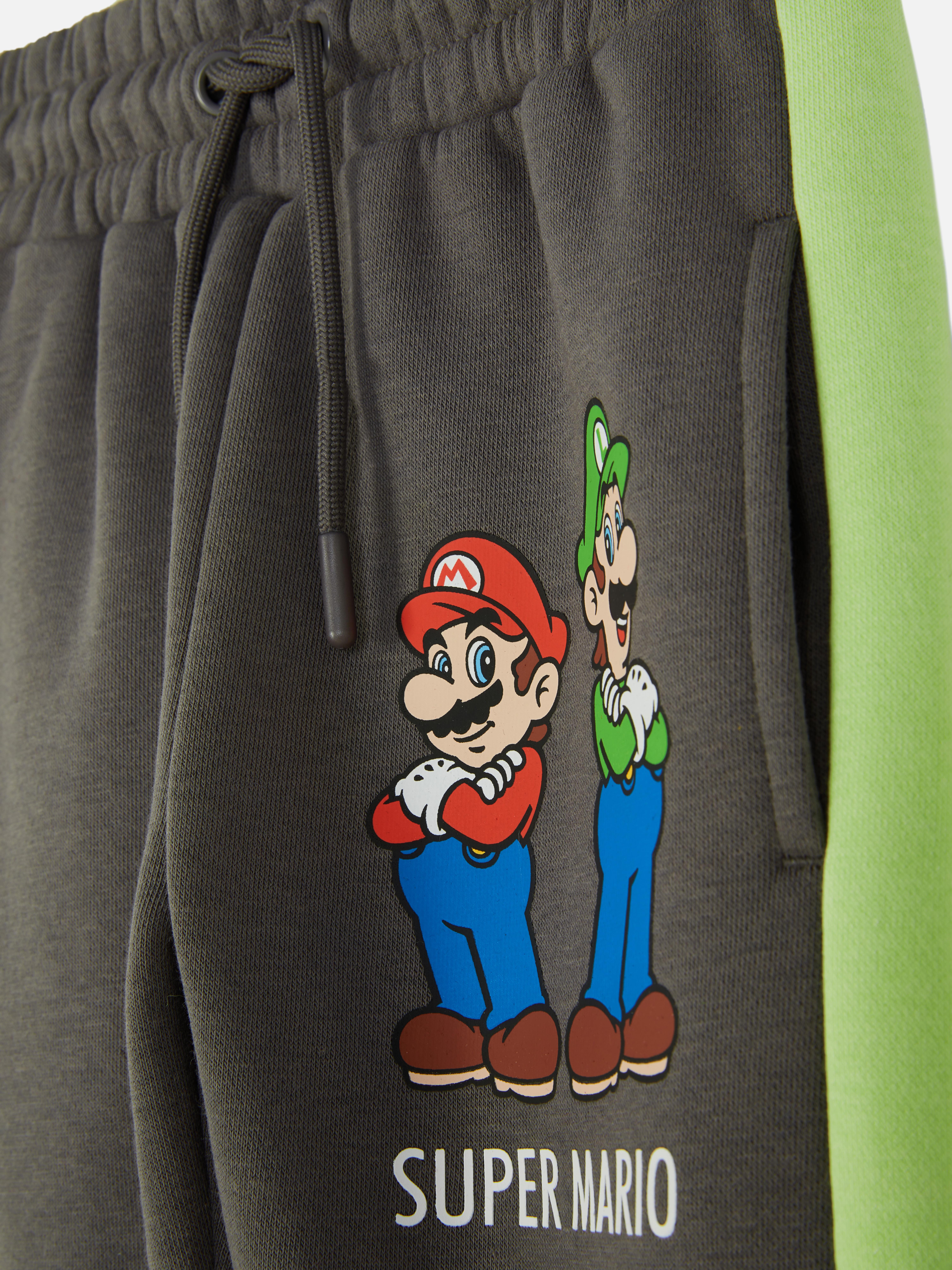 Pantaloni de trening asortați cu Super Mario Pantaloni de trening cu design Super Mario, șnur de strângere, buzunare și manșete la gleznă