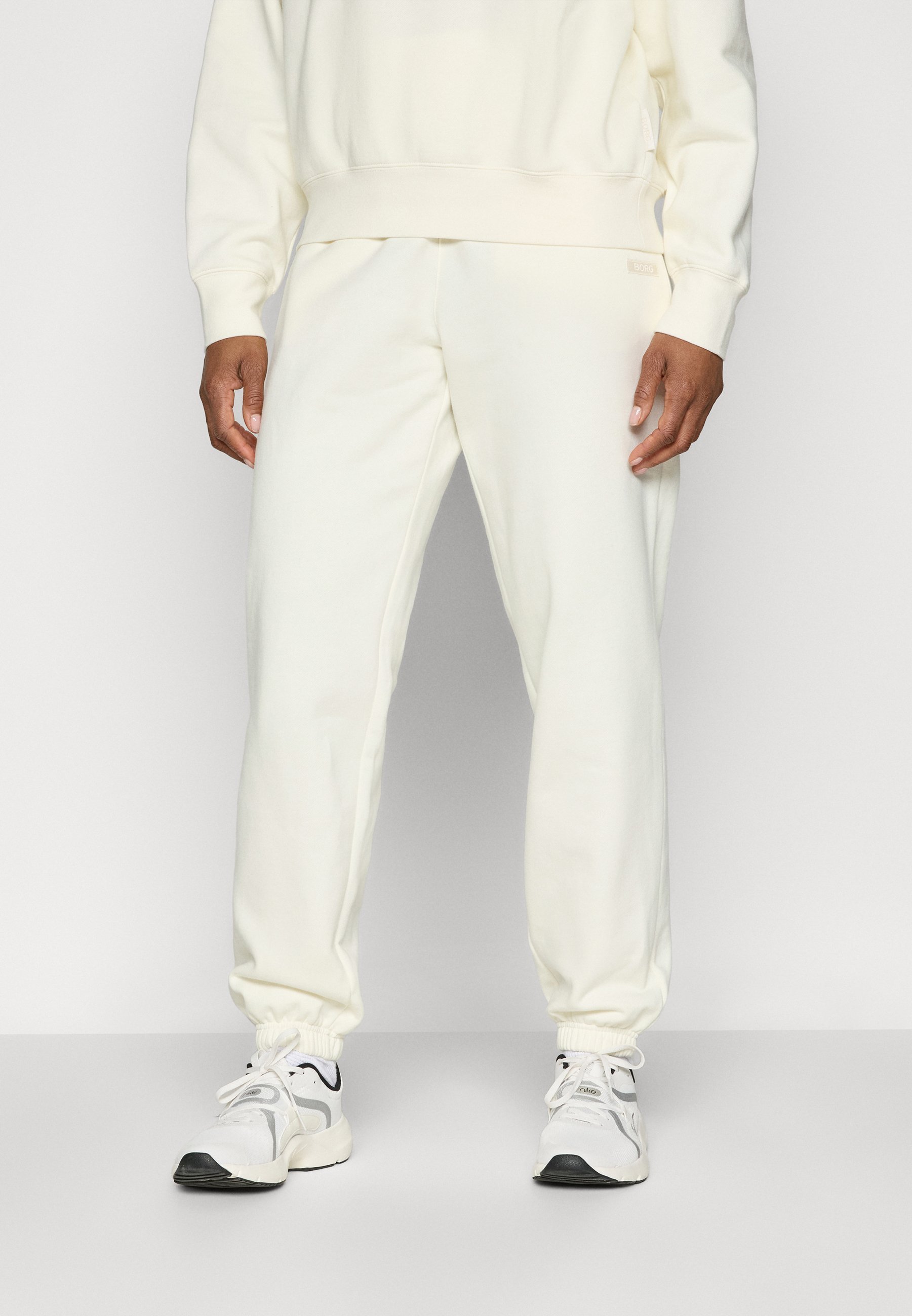 Pantaloni della tuta Björn Borg STUDIO - Tracksuit bottoms - cannoli cream