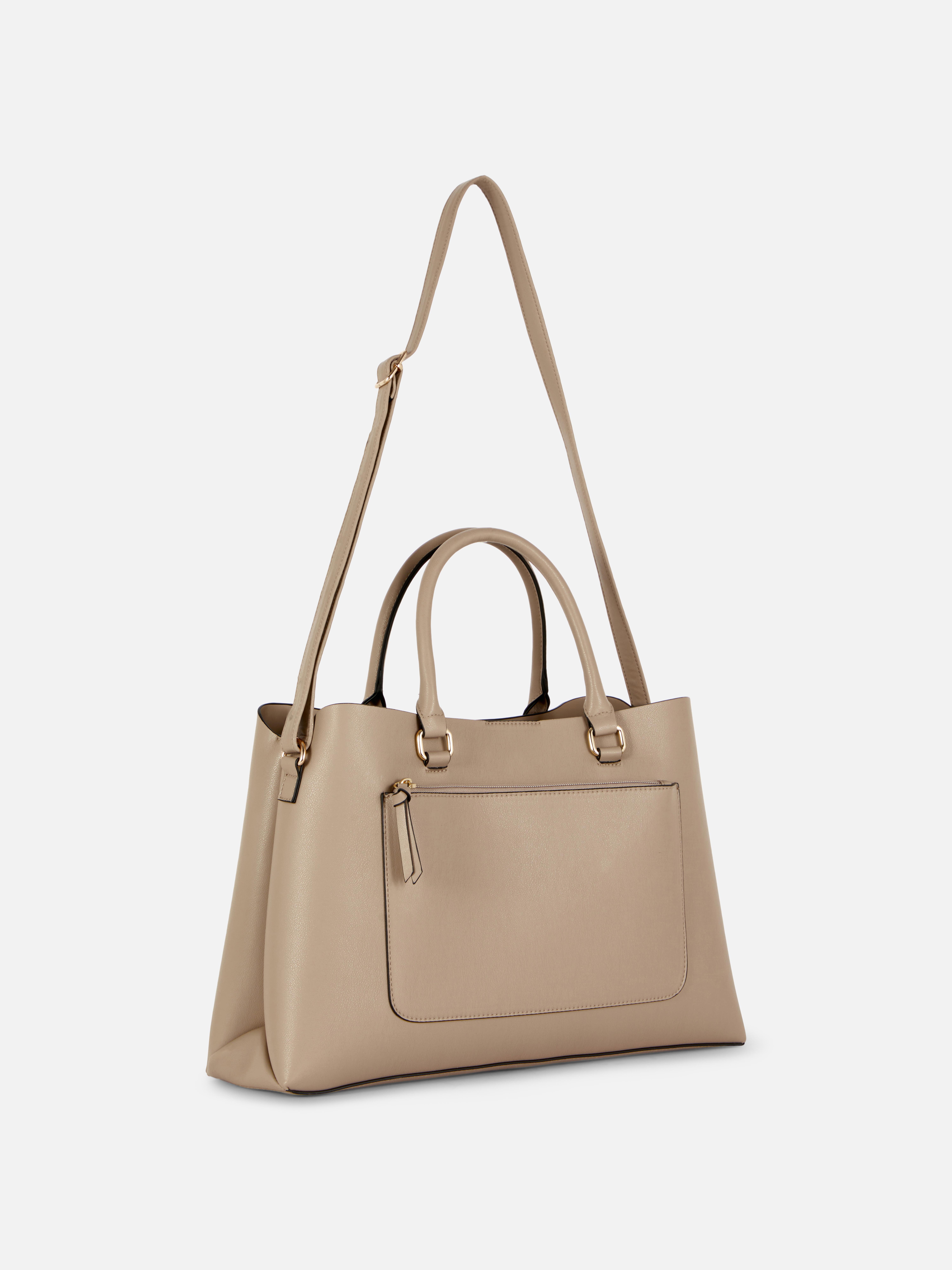 Geantă tote din piele ecologică cu buzunar cu fermoar. Geanta ta tote de zi cu zi este acum și mai elegantă, din piele ecologică cu buzunare.