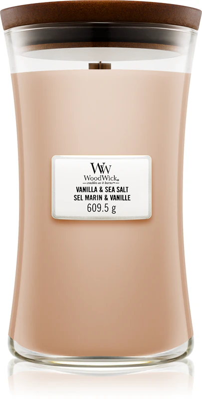 Vela perfumada Woodwick com aroma de baunilha e sal marinho e pavio de madeira.