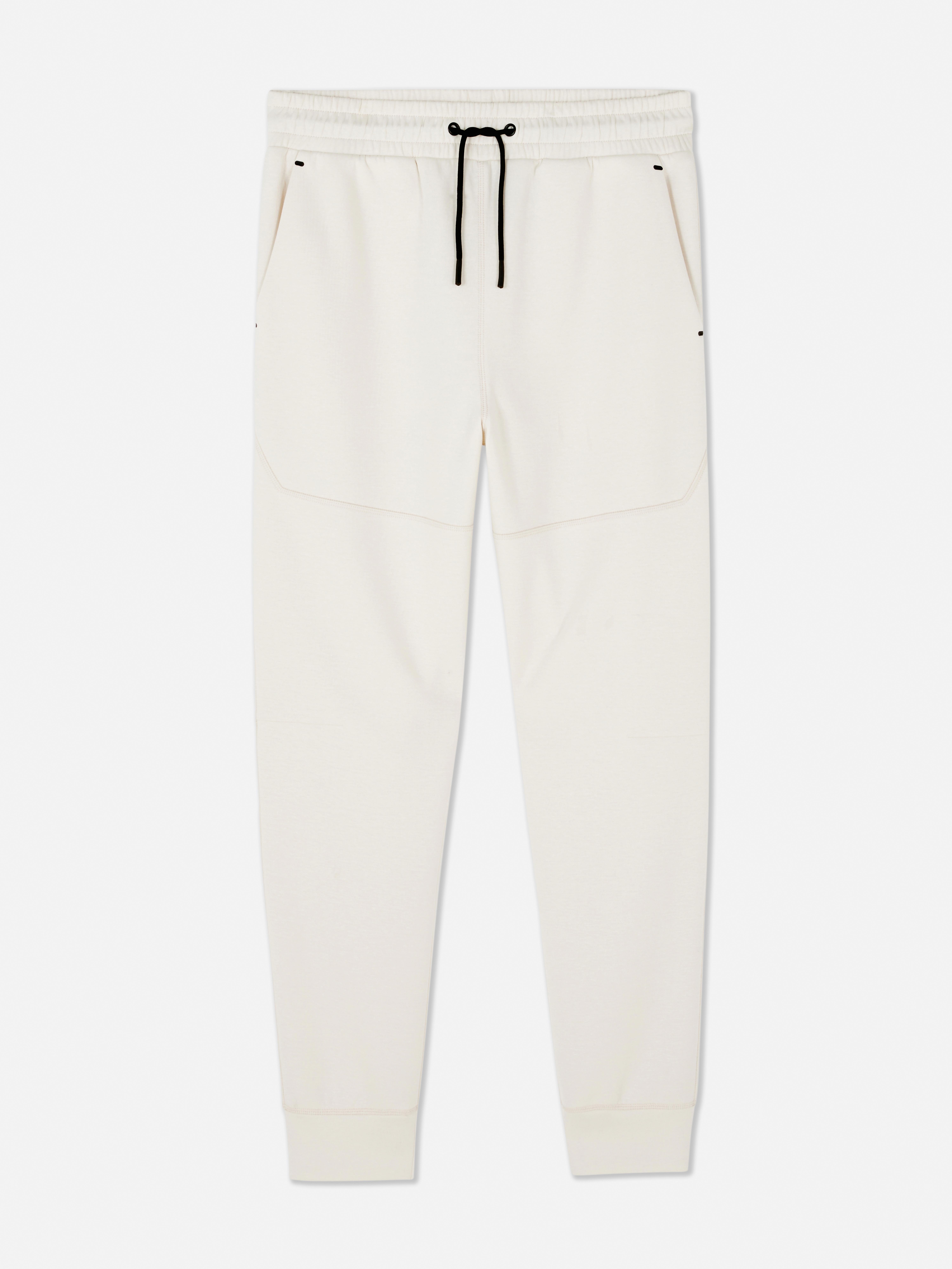 Pantaloni de jogging cu șnur de strângere și manșete la gleznă. Pantaloni sport de jogging cu șnur în talie, buzunare laterale și manșete la gleznă.