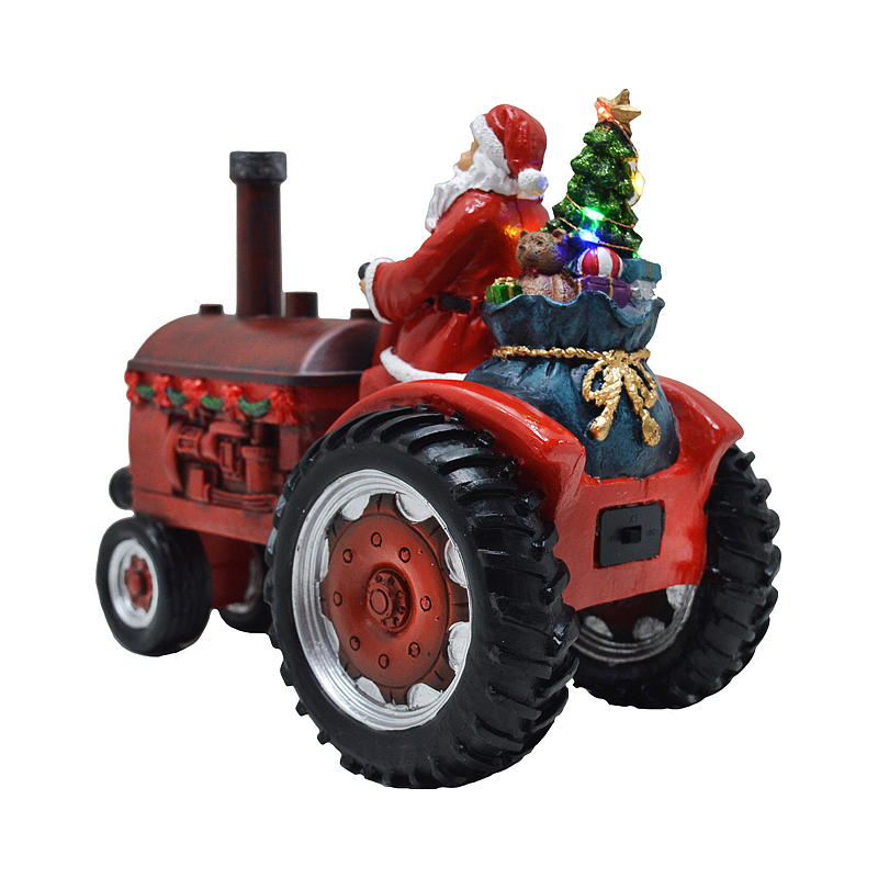 Lätt IT-traktor med jultomten, ljus och ånga