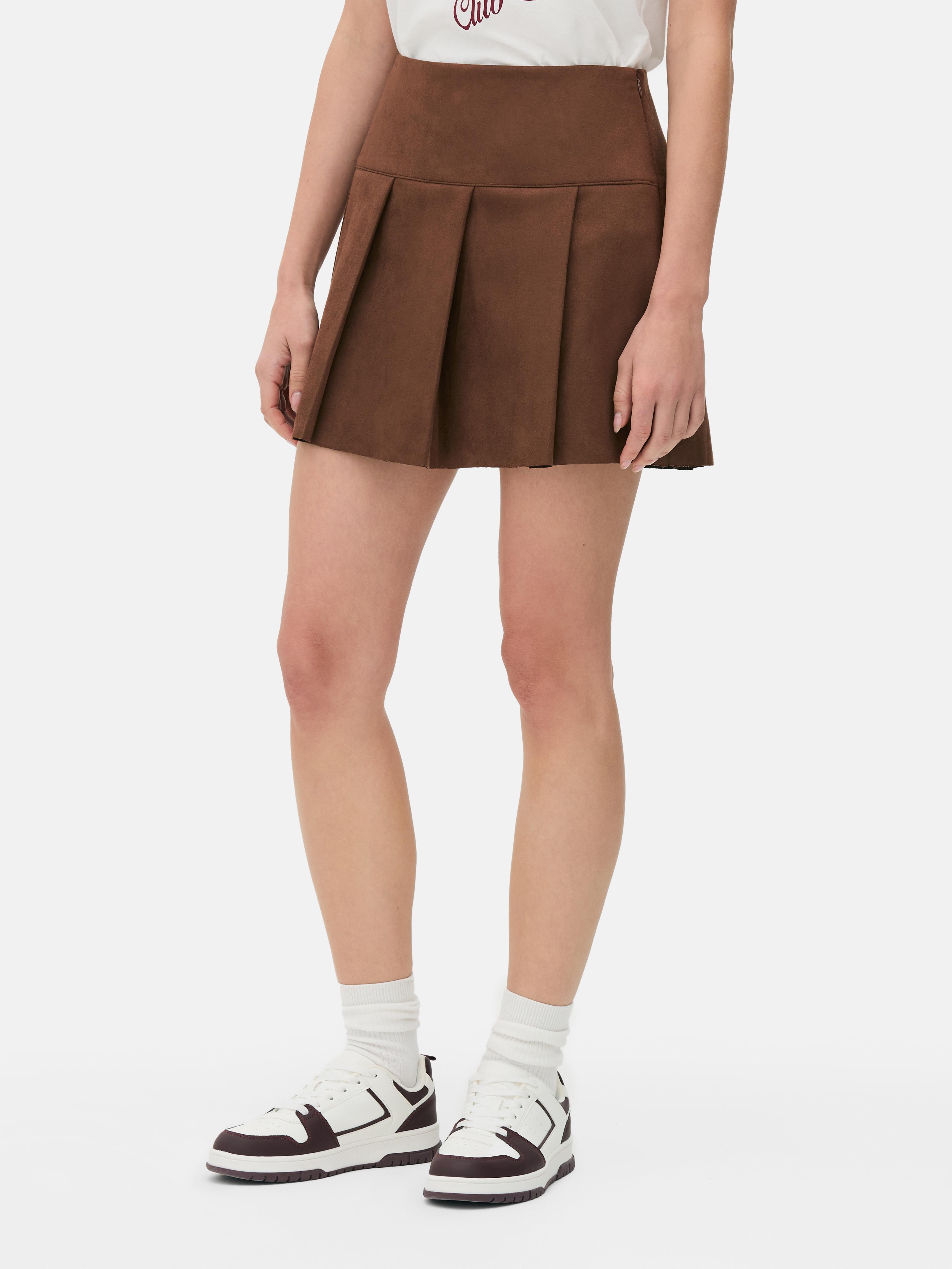 Suede pleated mini skirt A suede mini skirt with wide pleats and a side zipper