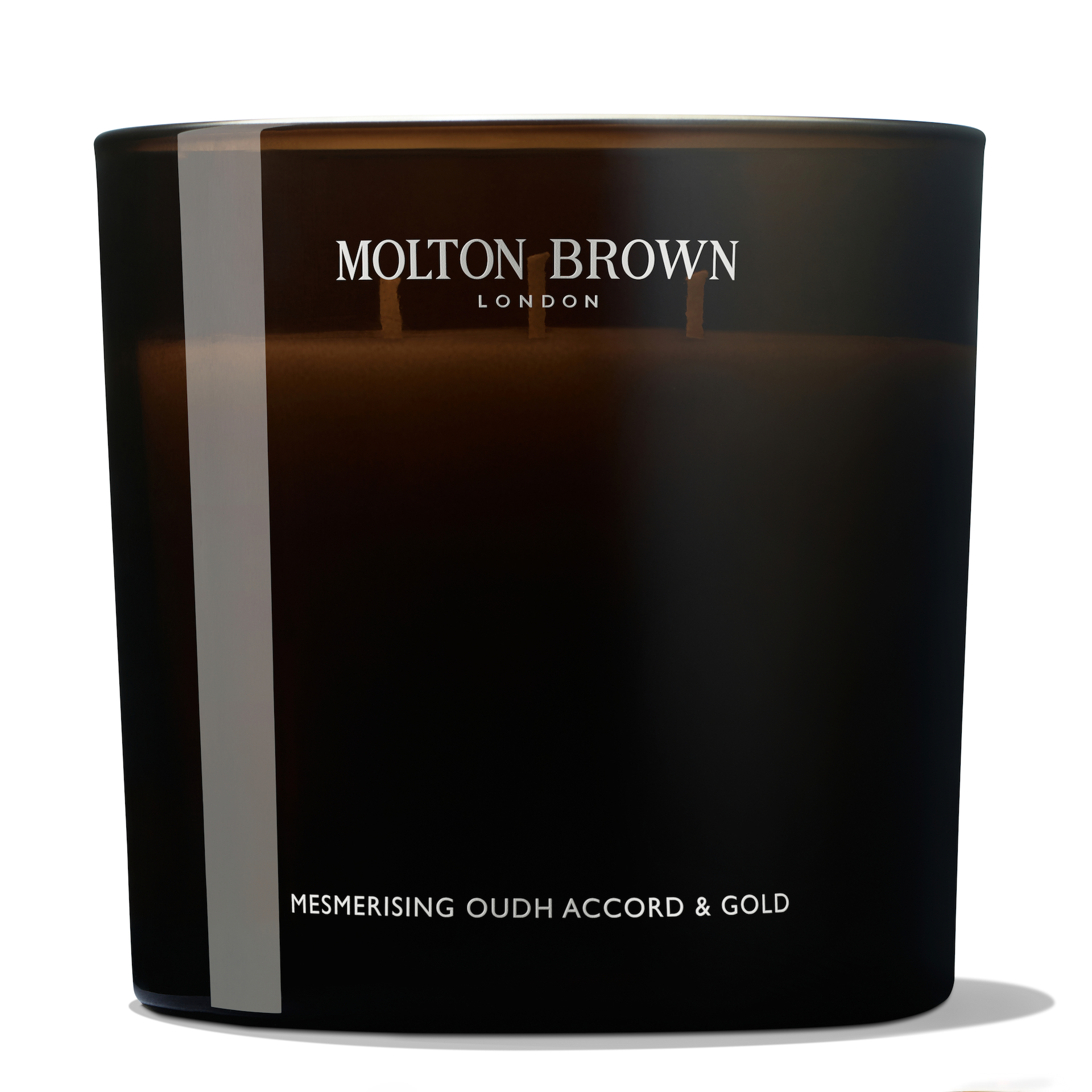 Hipnotikus Oudh Accord & Gold illatgyertya 600 g - Molton Brown