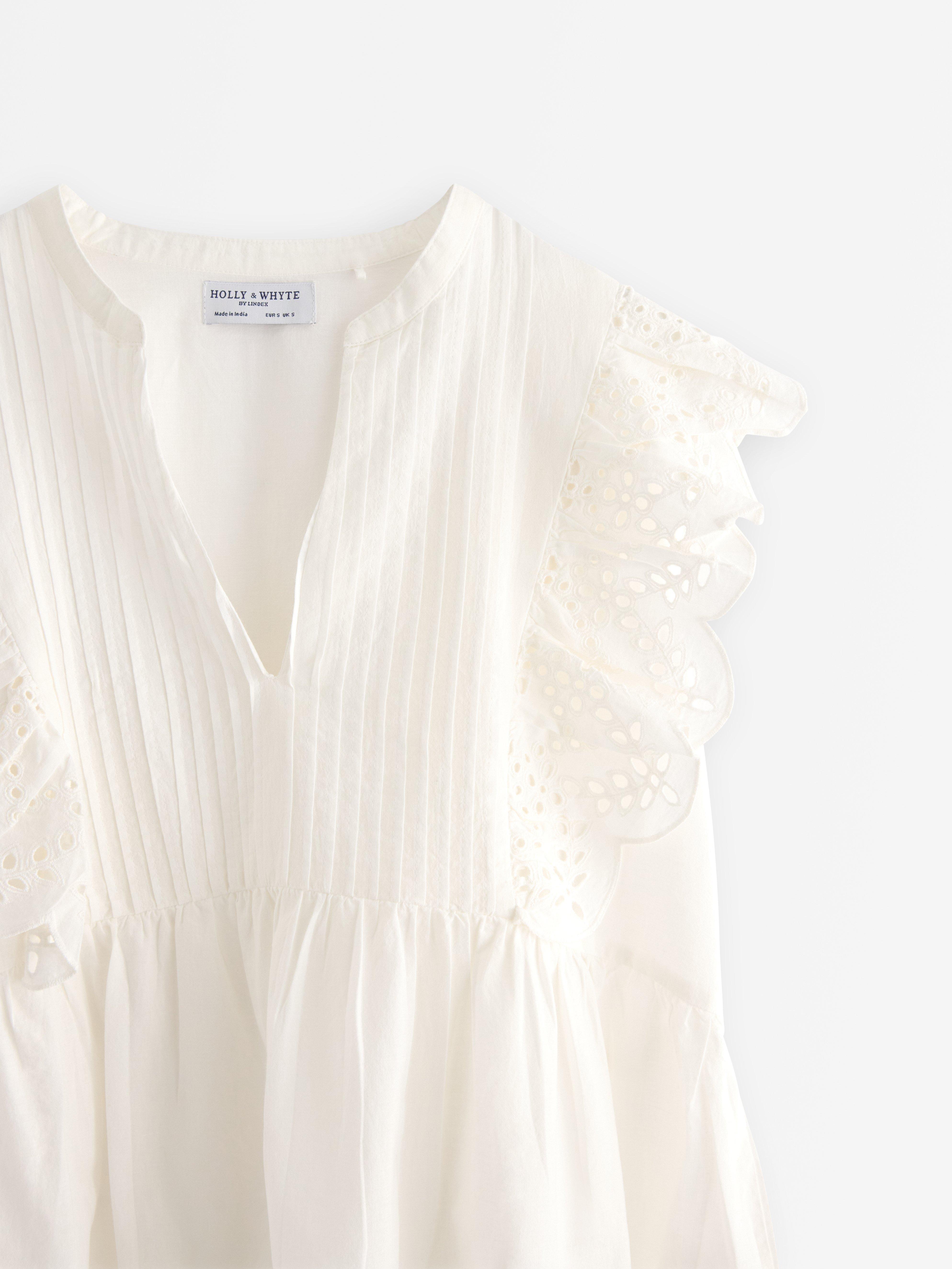 Bluza bez rukava s volanima, prljavo bijela