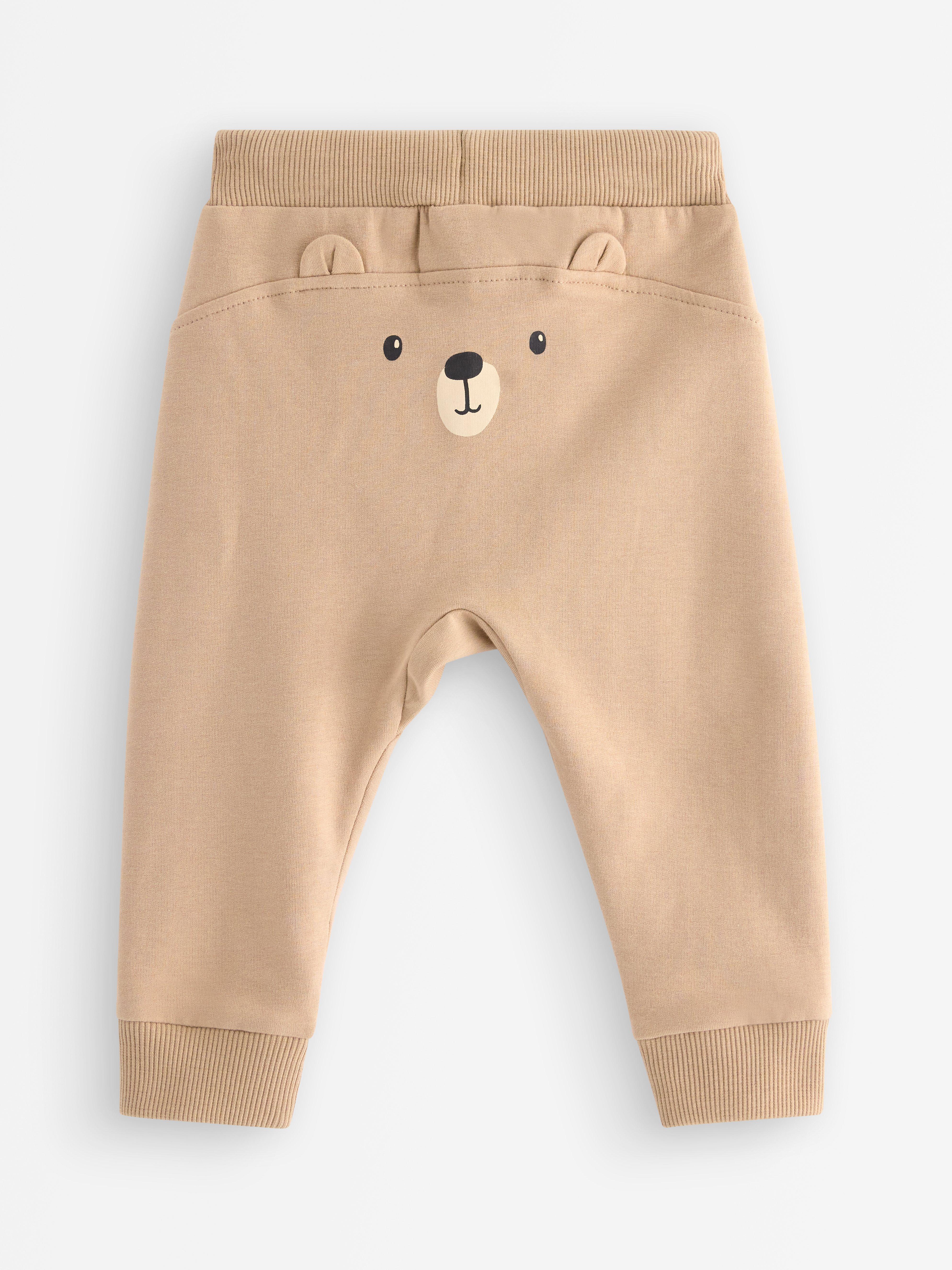 Pantalones deportivos color beige