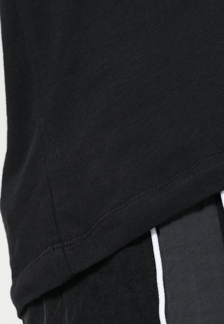 T-shirt de sport Nike Performance CREW SOLID - noir/blanc