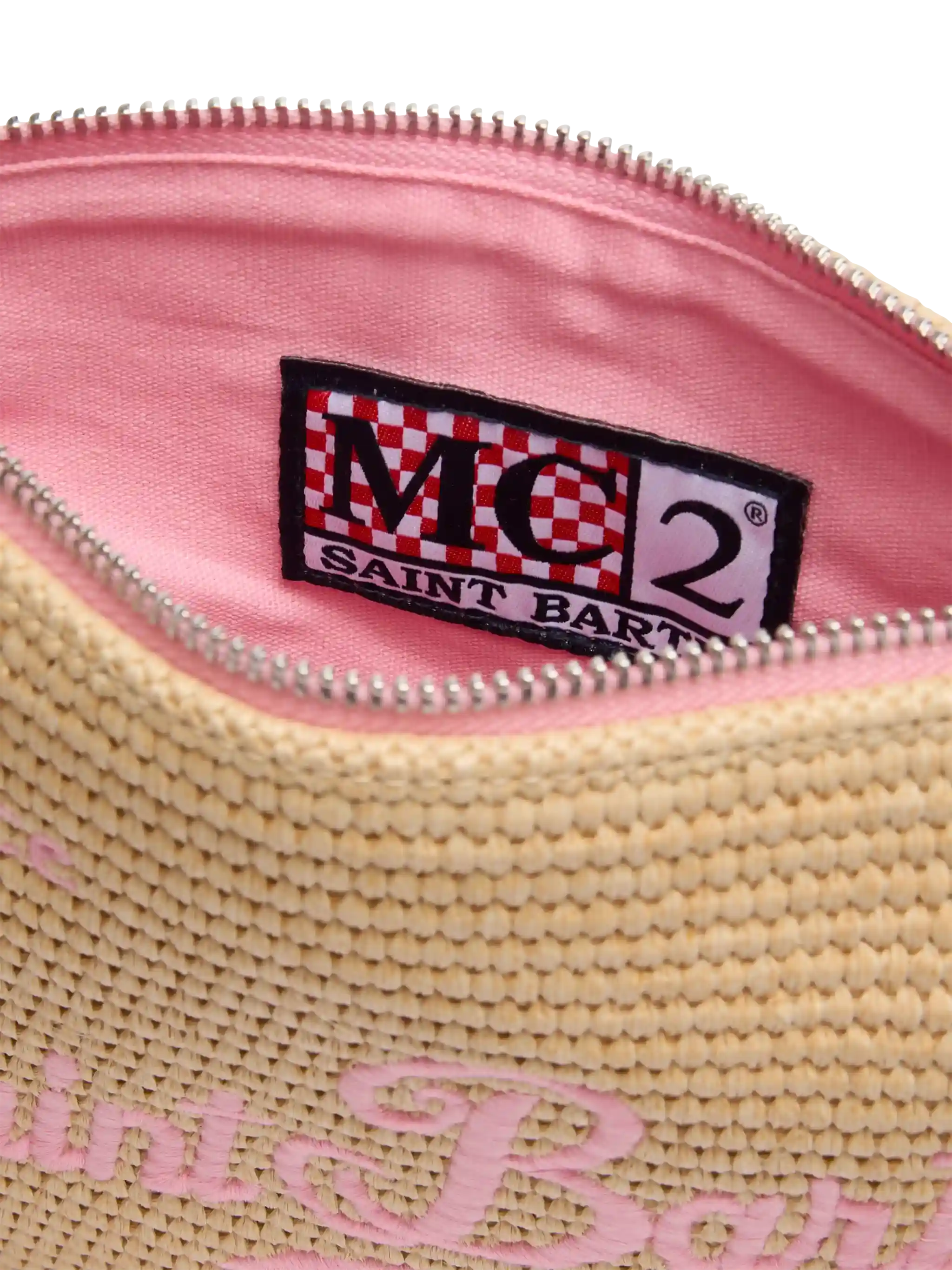 Parijse clutch met stro-effect en roze details.