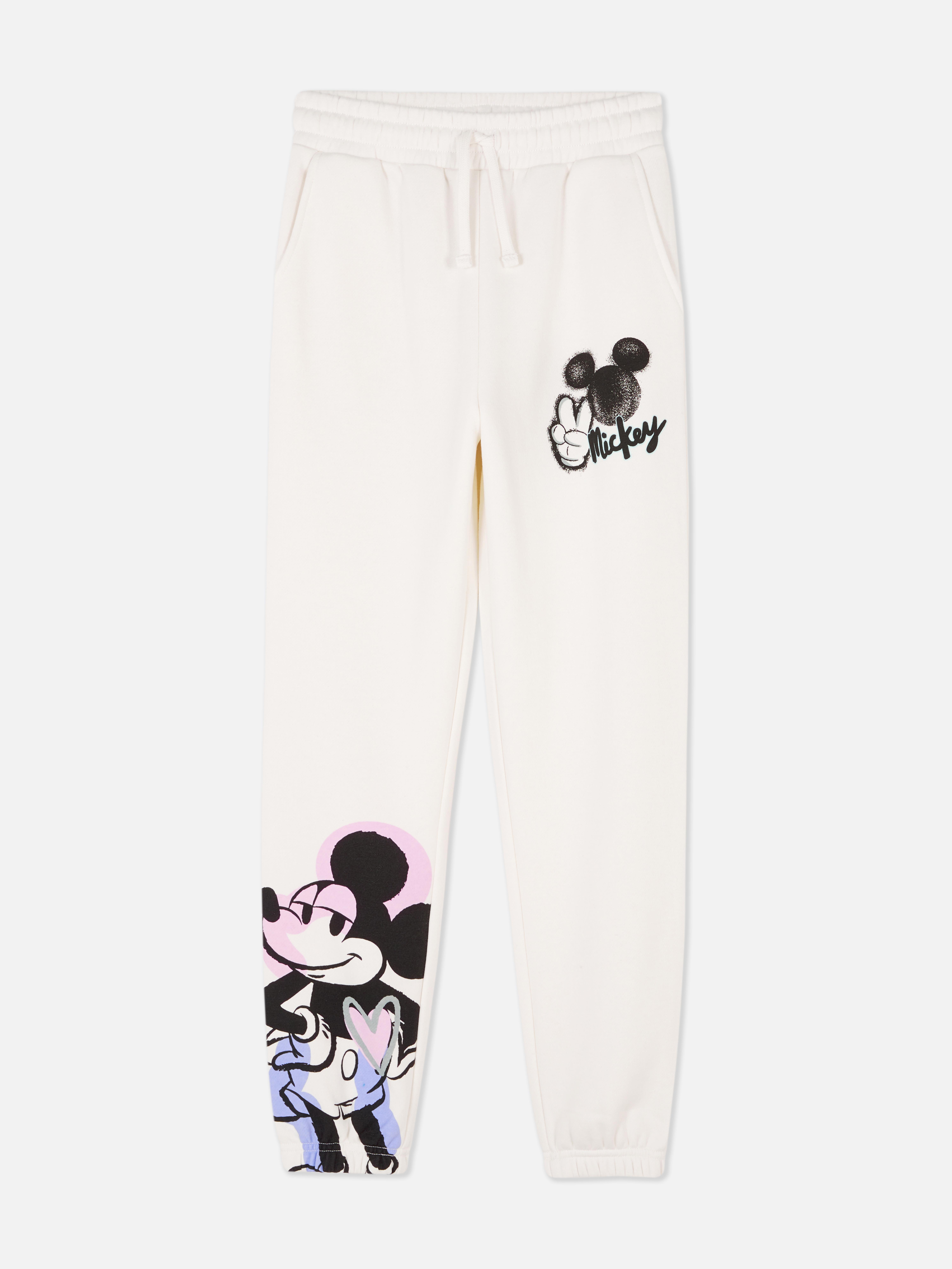 Pantaloni de trening cu șnur în talie cu model Disney Mickey Mouse. Pantaloni de trening cu șnur în talie, buzunare, manșete la gleznă și model Mickey Mouse.