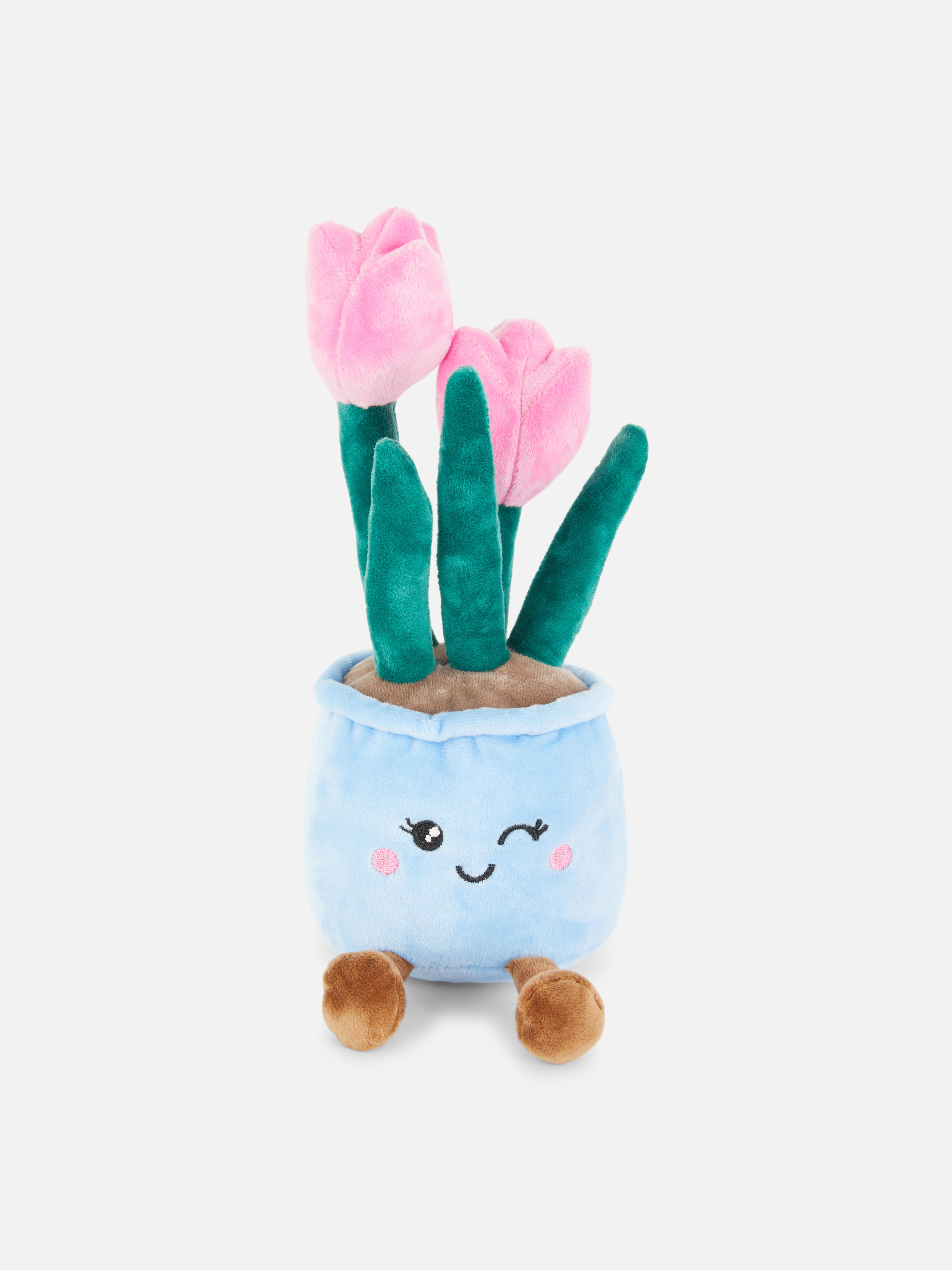 Tulipán plüssjáték Egy aranyos plüssjáték tulipánokkal díszített kaspó formájában