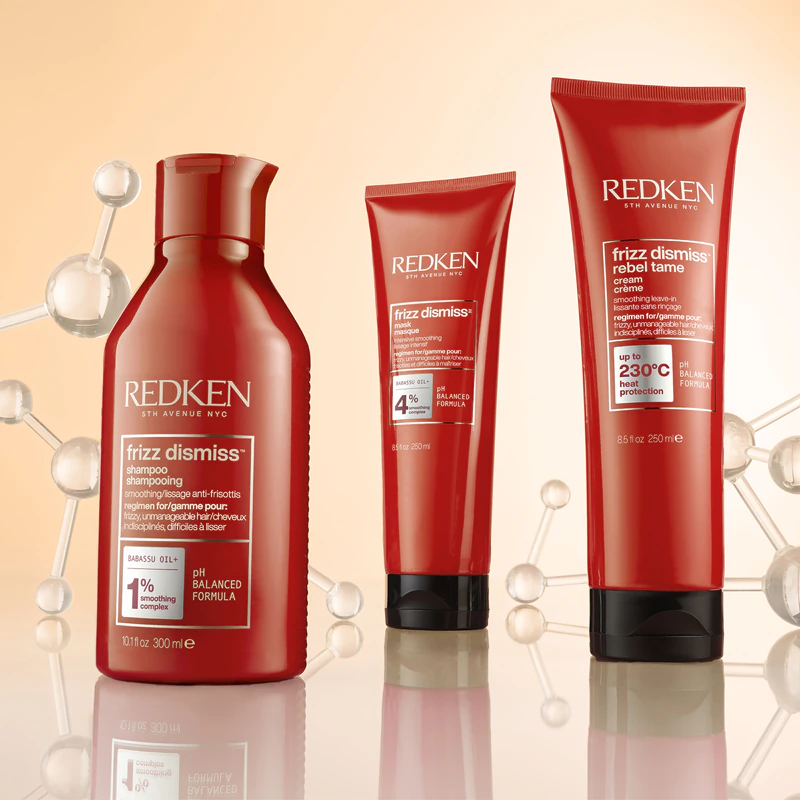 Die Hitzeschutzcreme Redken Frizz Dismiss glättet widerspenstiges Haar