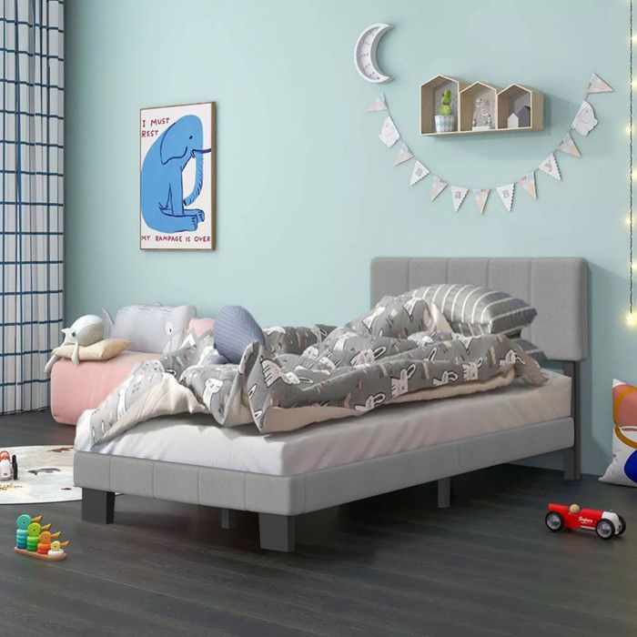 Cama infantil de 90 x 200 cm con somier de láminas incluido, estructura moderna, cabecero regulable en altura, color gris.