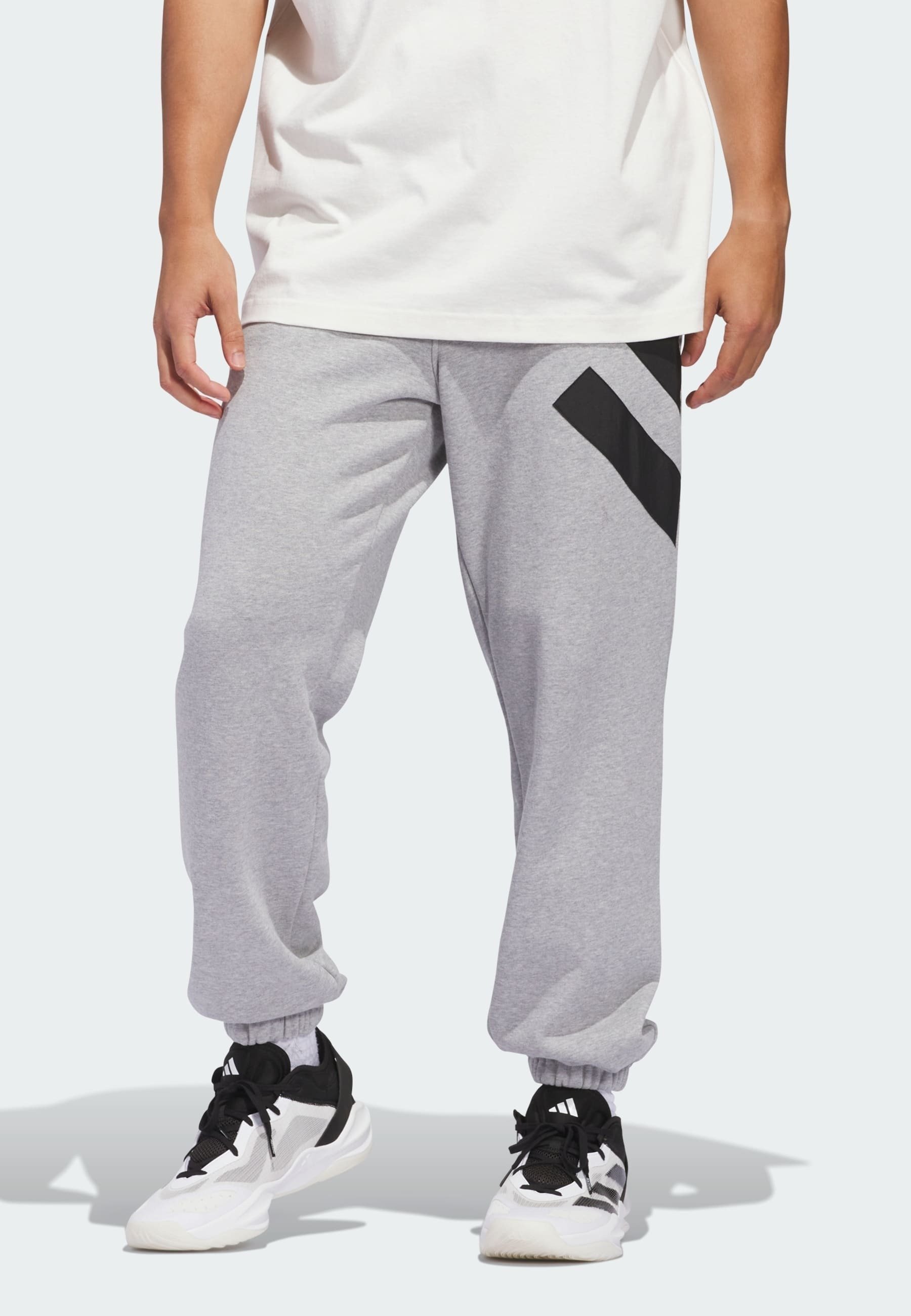 Teplákové nohavice adidas Originals - stredne sivá vresová