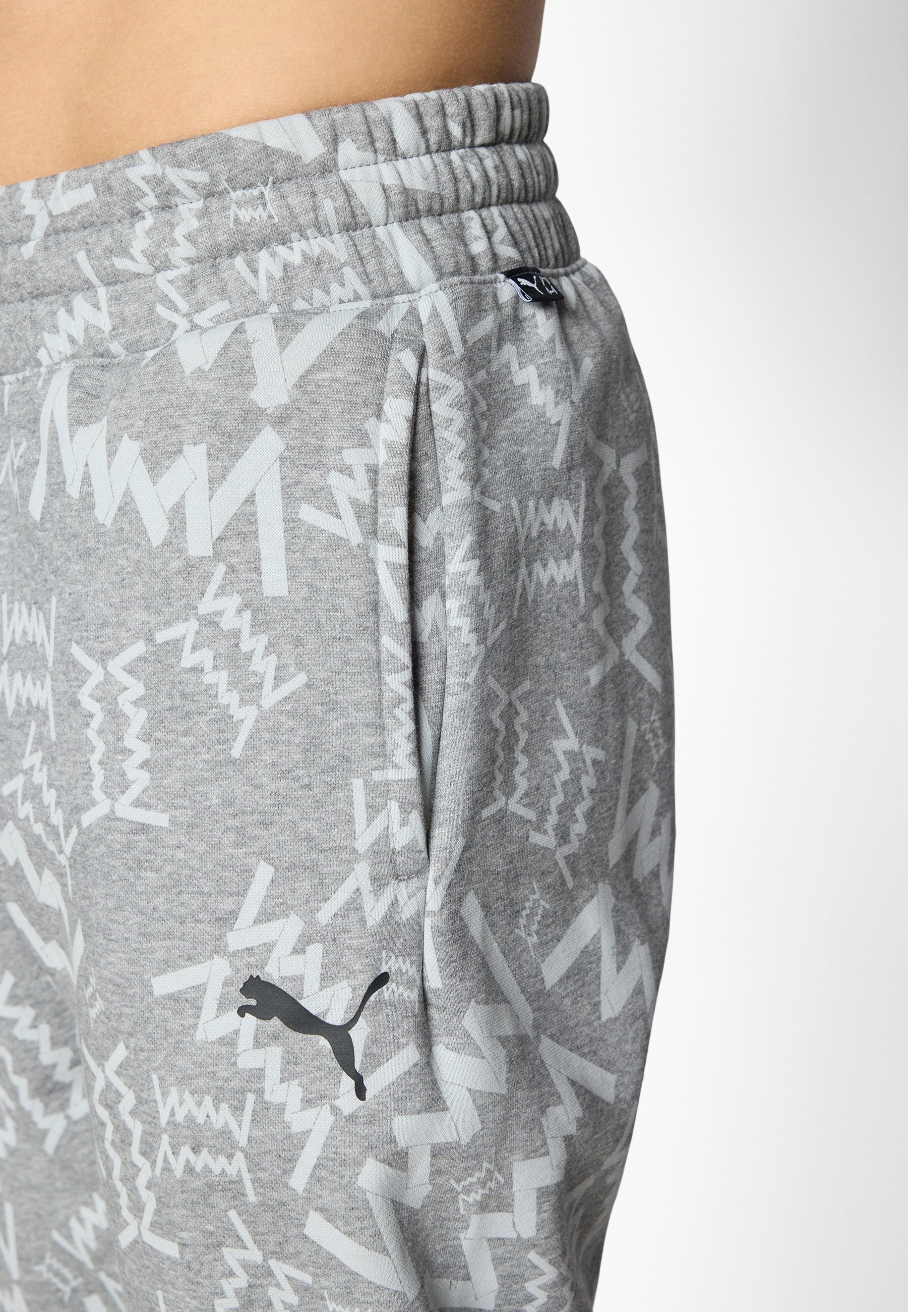 Puma TEAMJAWS POST GAME PANTS - Teplákové kalhoty - black