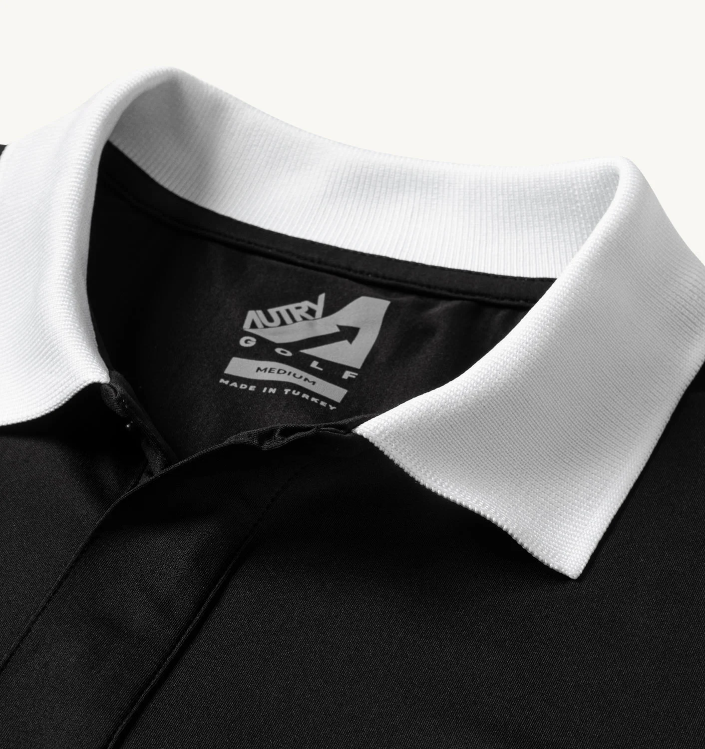 TRICOU DE GOLF NEGRU CU GUARNIȚII CONTRASTANTE
