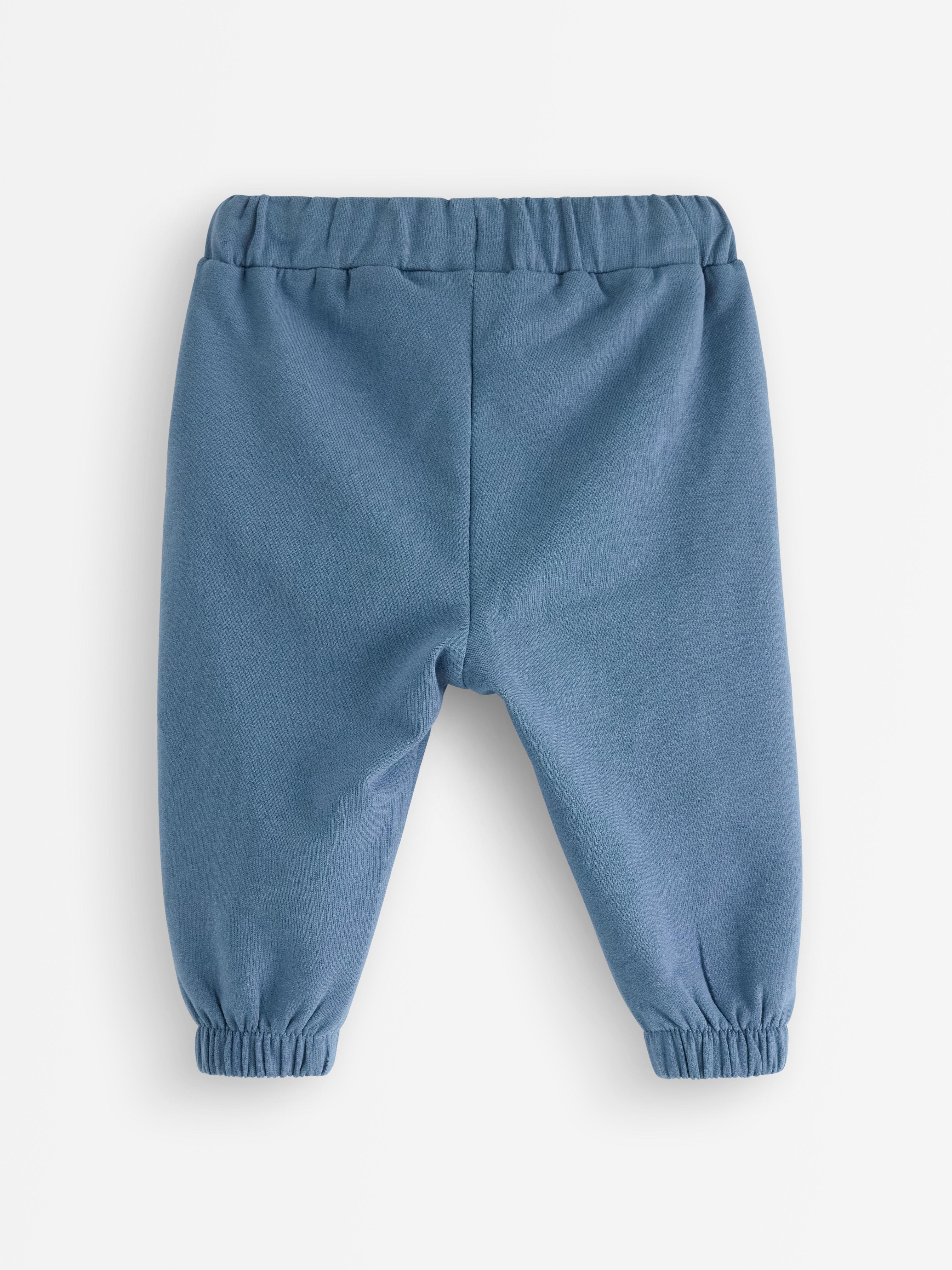 Pantalones deportivos con interior cepillado, color azul oscuro empolvado.