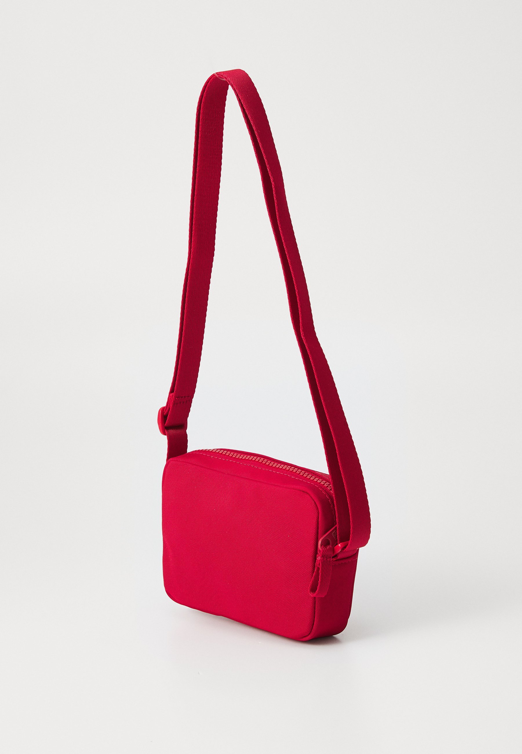 Tommy Hilfiger SCRIPT FLAG CROSSOVER BAG UNISEX - Umhängetasche - mittelrot