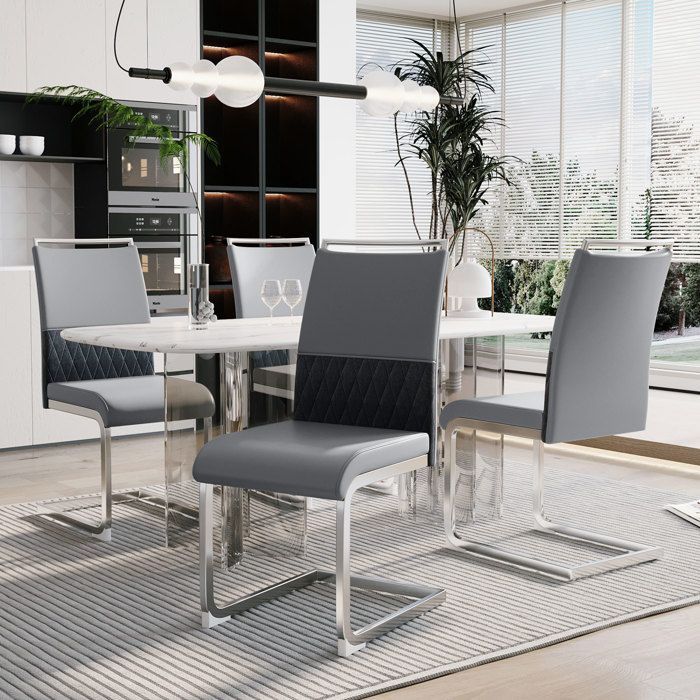 Juego de 4 sillas de comedor modernas, fabricadas en material grueso y resistente a la corrosión, con respaldo de cuero sintético PU y material sintético.