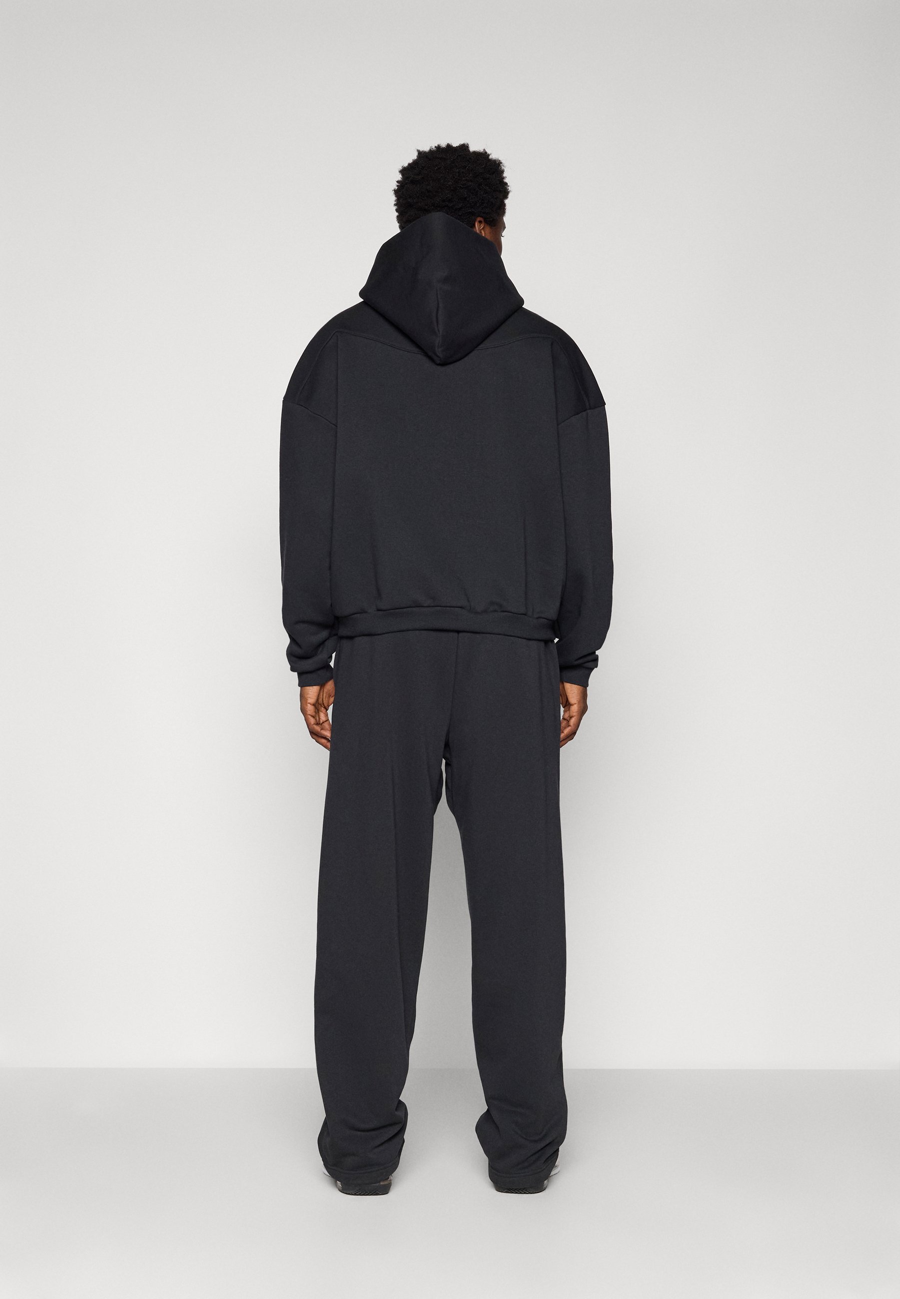 Nike Performance Hose mit offenem Saum – Trainingshose – schwarz/hellelfenbein