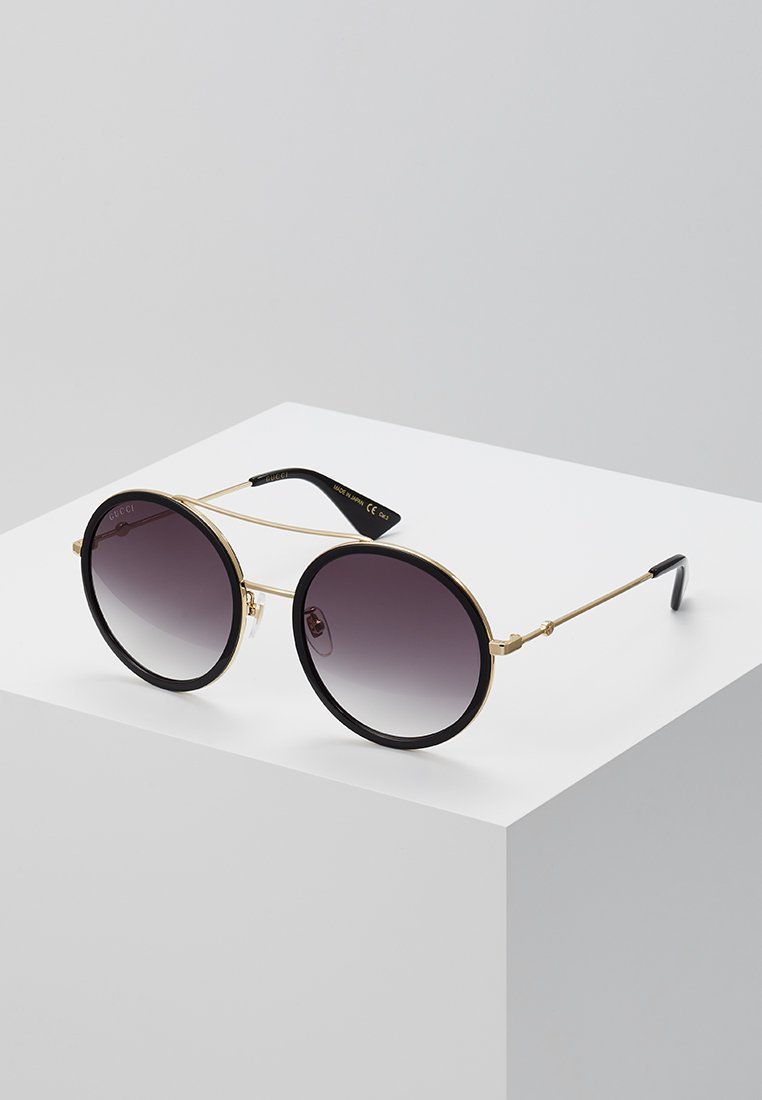 Lunettes de soleil Gucci - dorées/grises
