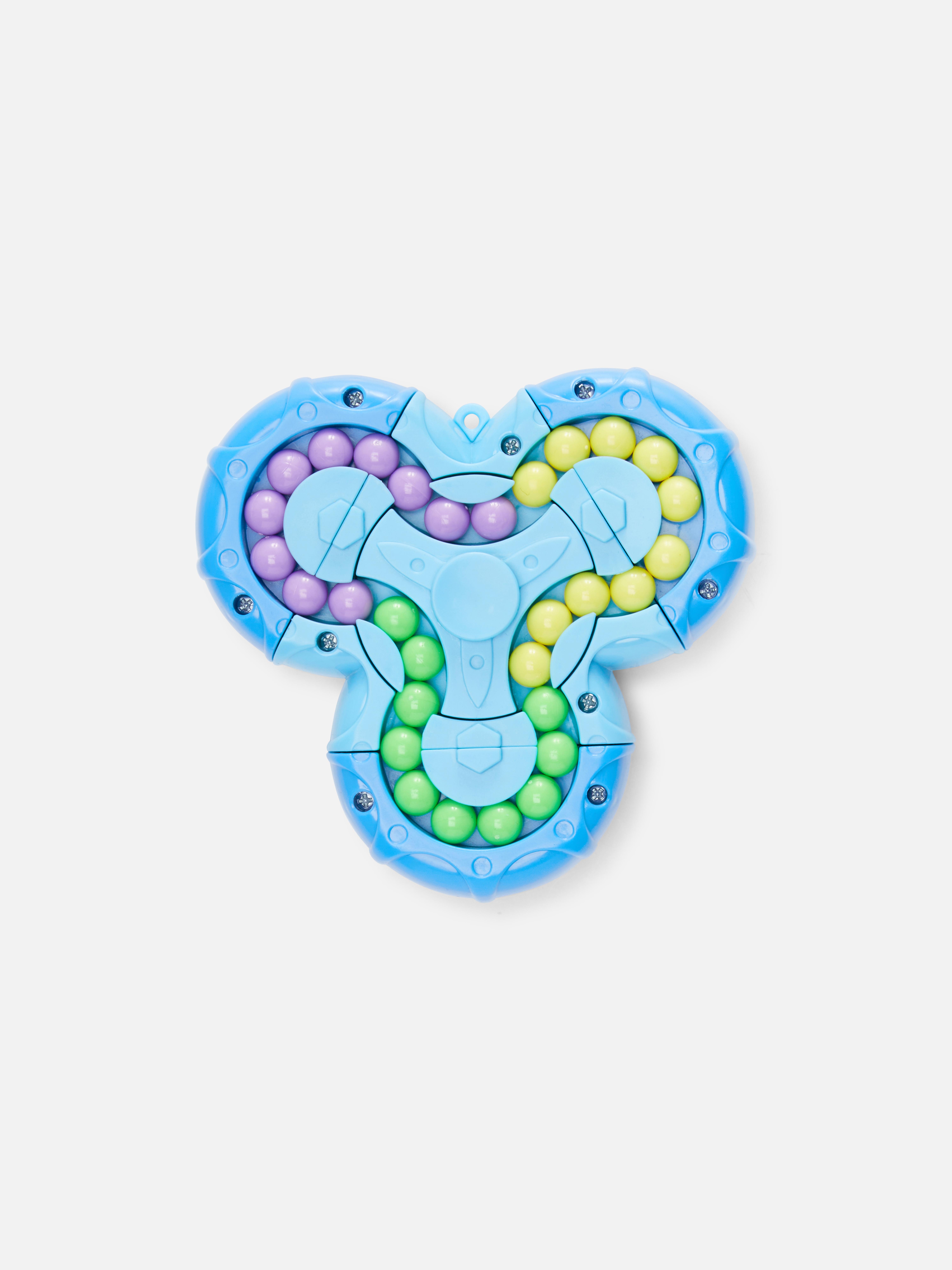 Gyöngypuzzle Egy interaktív kirakós játék izguló pörgettyű formájában