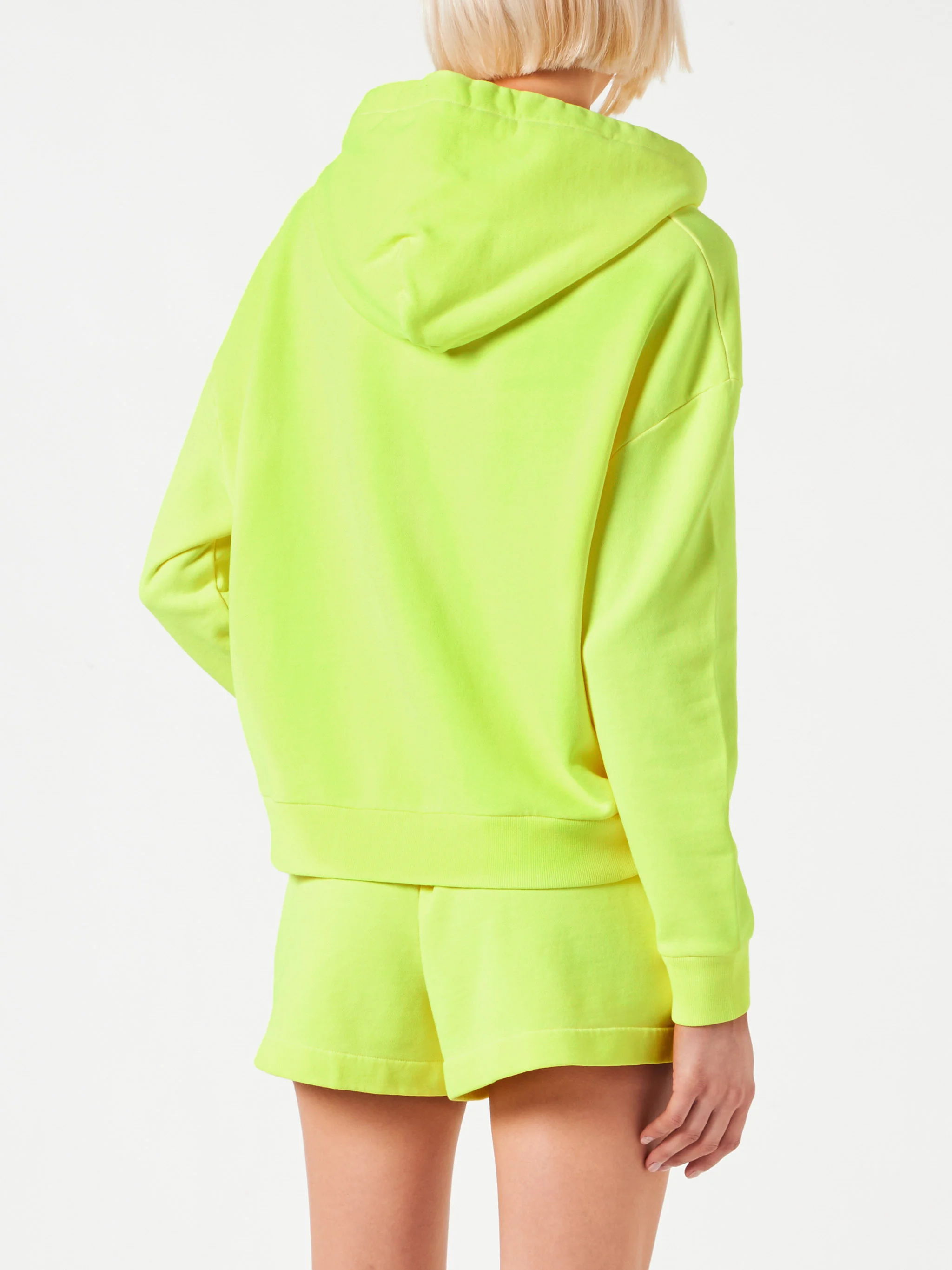 Fluorescerend gele hoodie met St. Barth-borduurwerk.