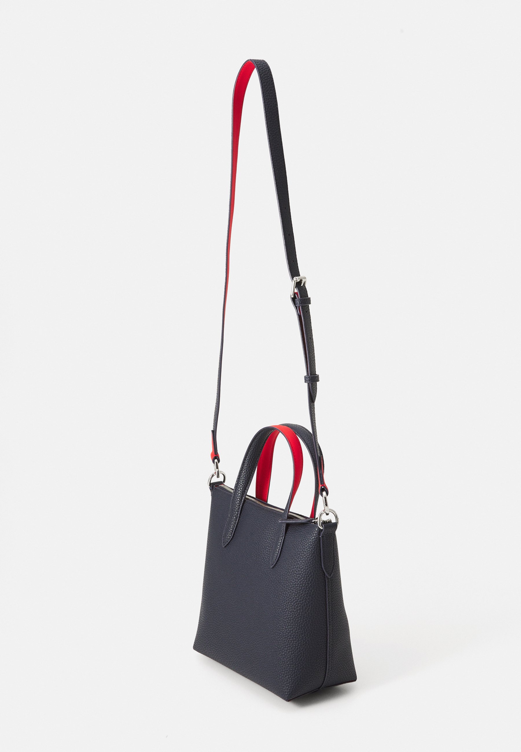 Lacoste Handtasche - marineblau/rot
