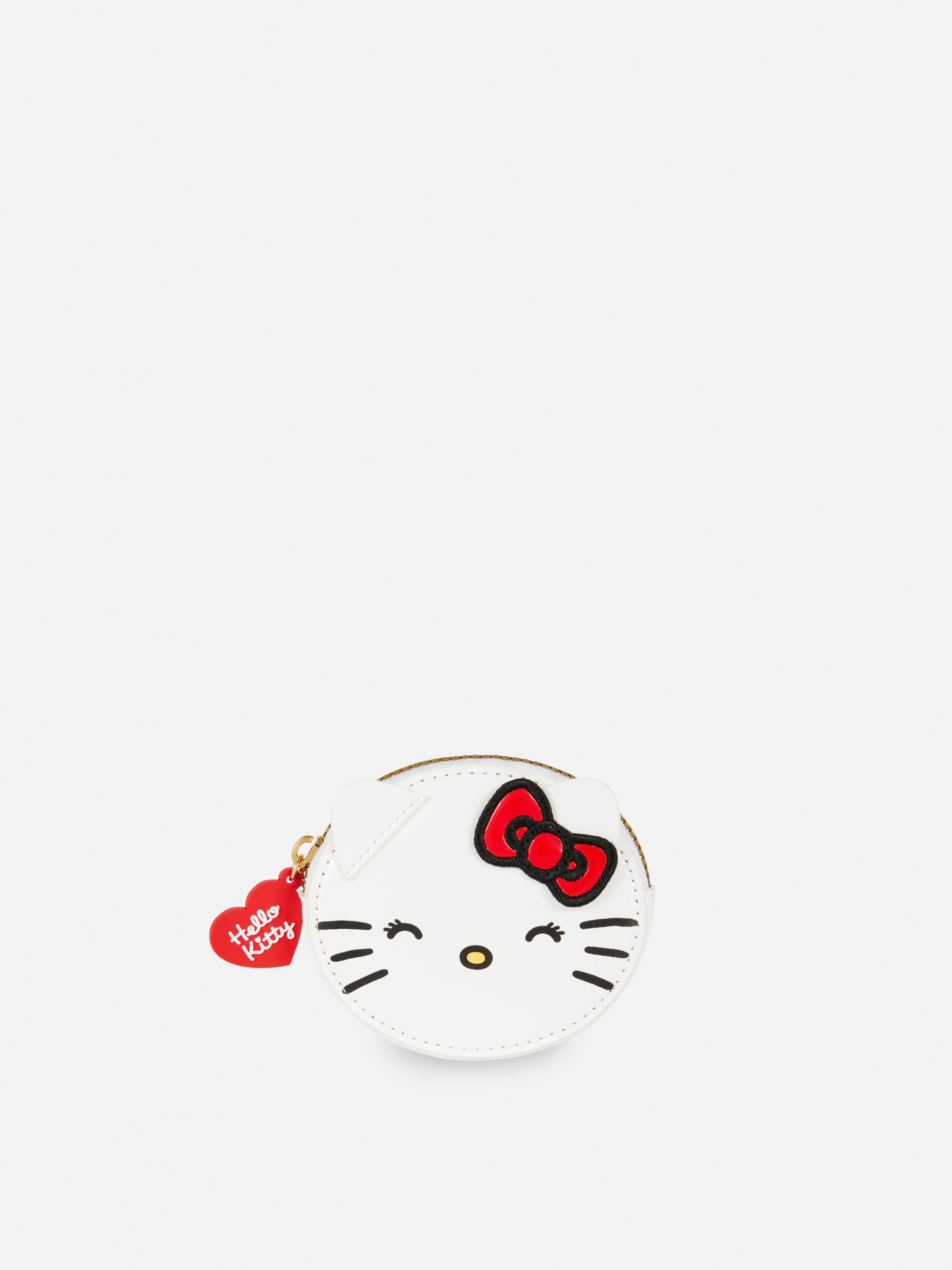 Portofel Hello Kitty Un portofel mic cu pisicuța albă, cu fermoar și un pandantiv în formă de inimă