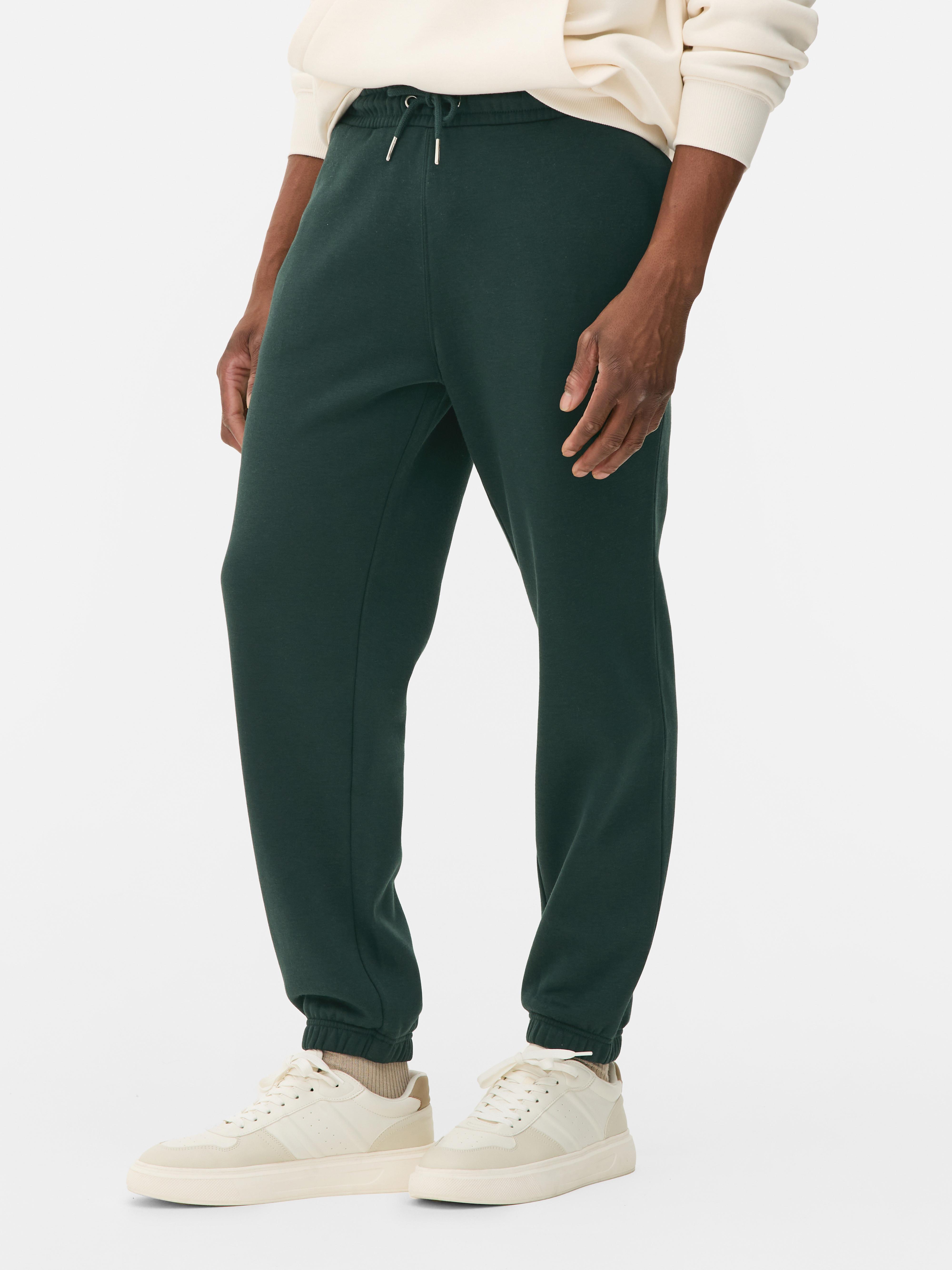 Pantaloni de jogging esențiali cu șnur de strângere Acești pantaloni de jogging confortabili cu șnur de strângere și buzunar aplicat la spate sunt casual și potriviți pentru relaxare