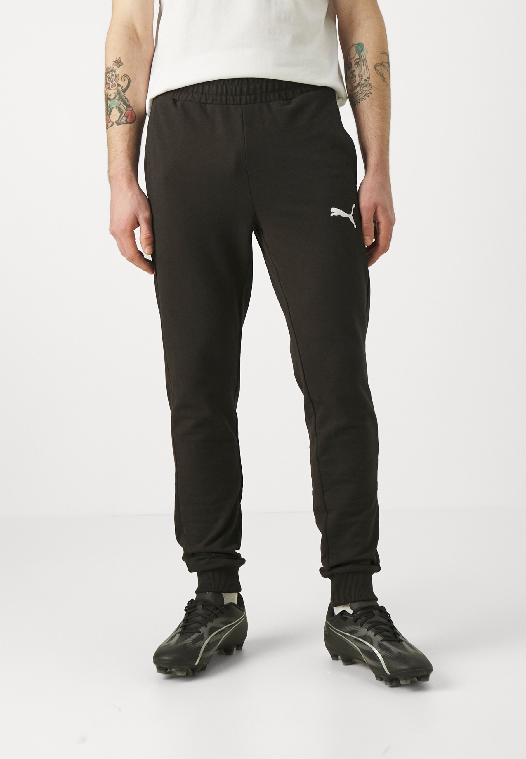 Puma TEAMGOAL CASUALS HLAČE - Donji dio trenirke - crno/bijelo
